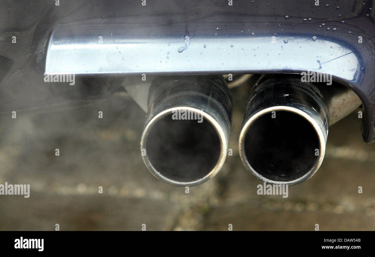Exhaust fumes emerge from a double exhaust pipe of a car in Lichtenfels
