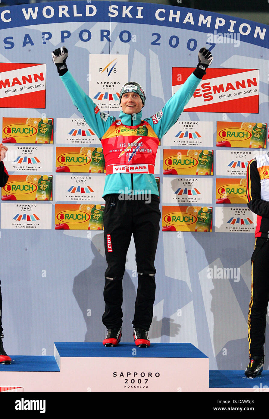 Finnish Hannu Manninen cheers winning the Nordic Combined of the Nordic