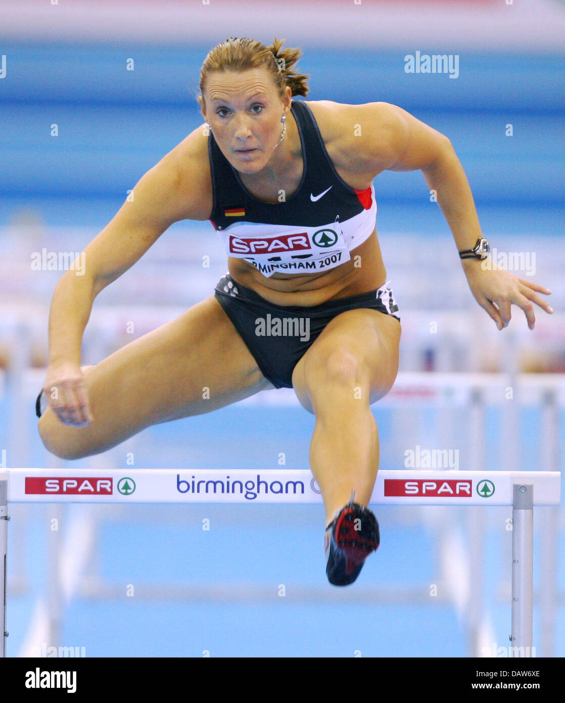 German athlete Kirsten Bolm takes a hurdle at the Ladies' 60m Hurdles ...