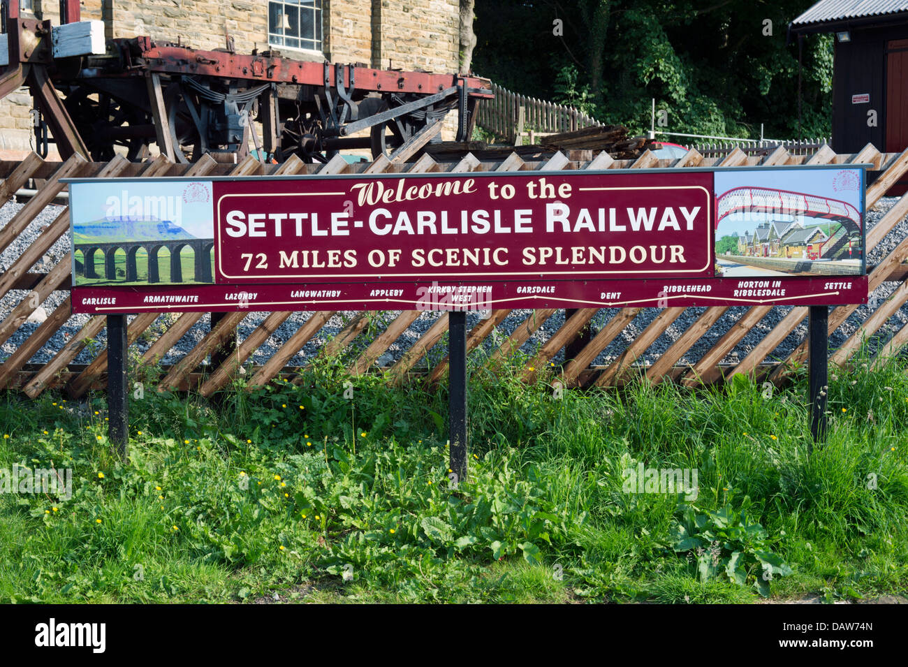 Settle station yard with sign board for the Settle to Carlisle railway, Settle, North Yorkshire, UK Stock Photo