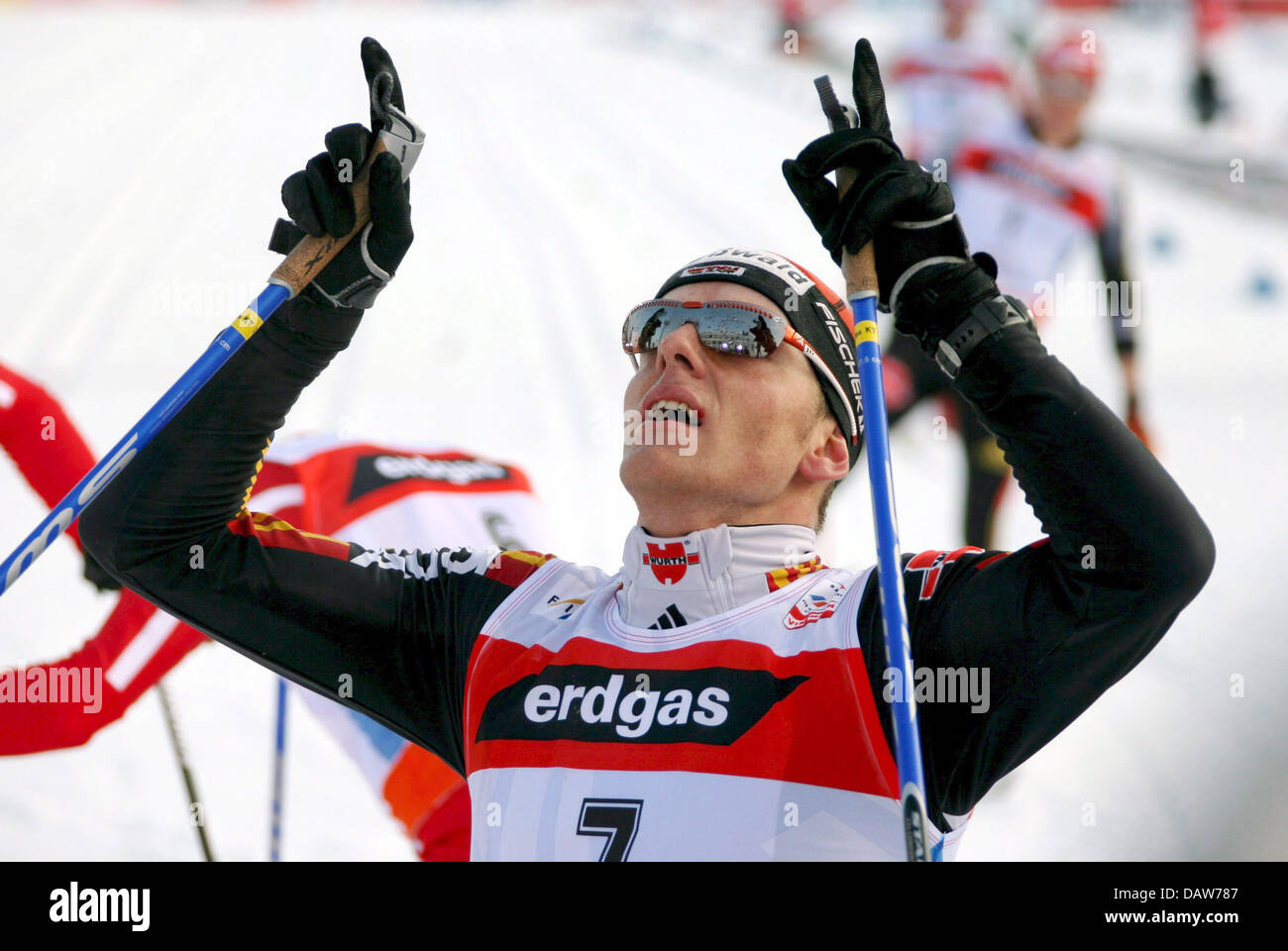 Third placed German Jens Filbrich celebrates exhaustedly after the men's 50km cross country competition at the Nordic Skiing World Championships in Sapporo, northern Japan, Sunday, 04 March 2007. Photo: KAY NIETFELD Stock Photo
