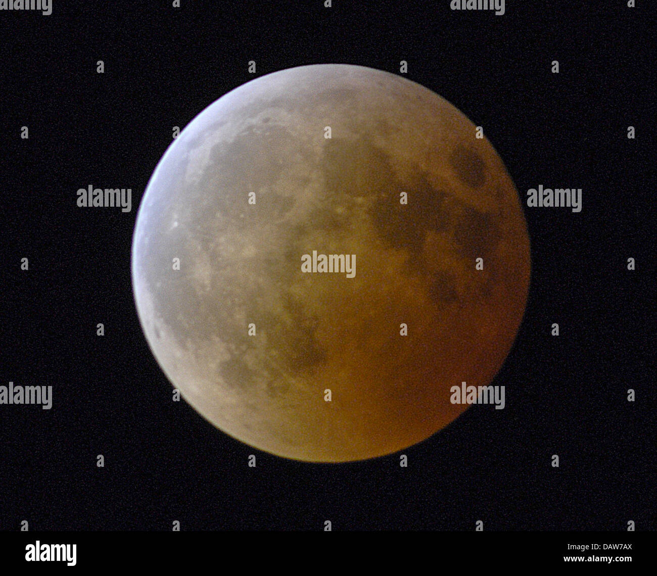 The moon is pictured at the start of a total eclipse over Dietzenbach