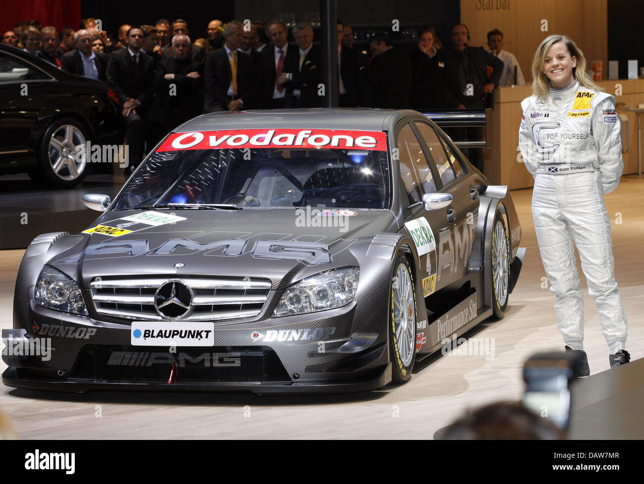 The AMG Mercedes C-Class DTM 2007 is presented by DTM pilot Susie Stoddart (R) at the Geneva Motor Show in Geneva, Switzerland, Tuesday, 06 March 2007. The trade show running from 8 to 18 March presents the latest developments of the automobile industry. Photo: Uli Deck Stock Photo