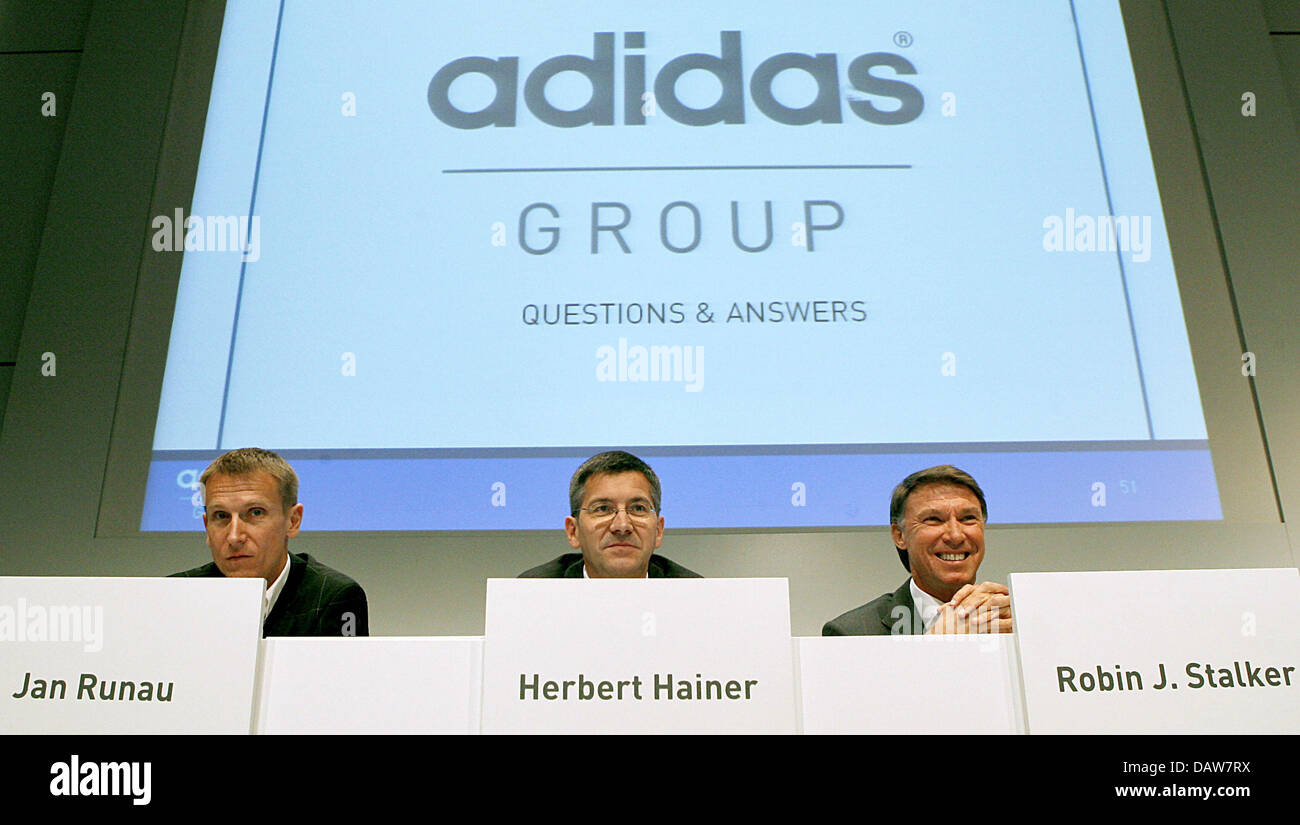 The CEO of sports articles manufacturer adidas, Herbert Hainer (C), PR  director Jan Runau (L) and CFO Robin J. Stalker are pictured at the  company's annual balance press conference in Herzogenaurach, Germany,