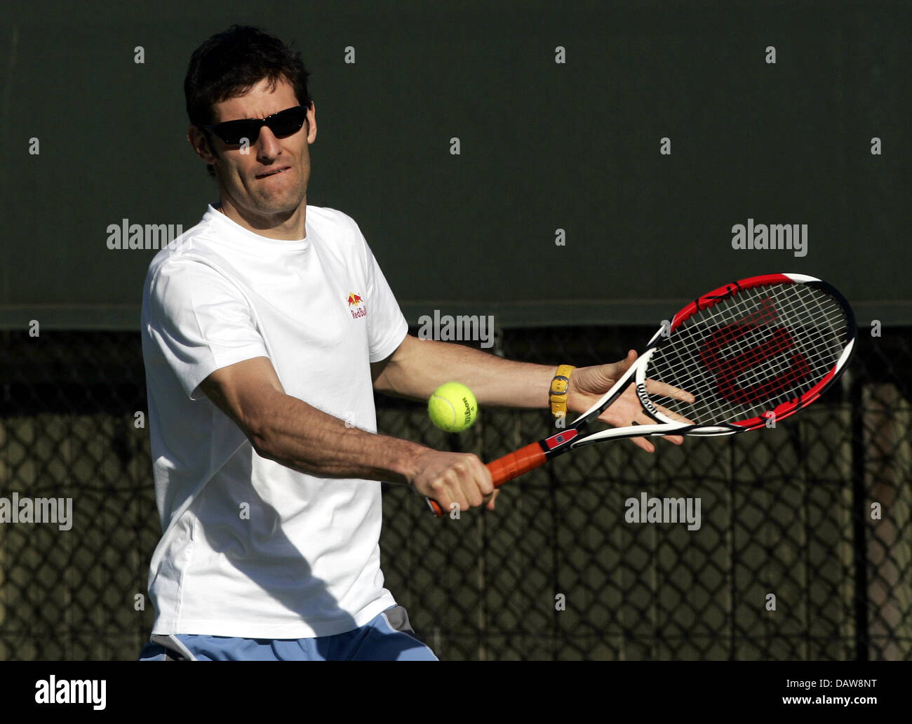 Australian Formula One pilot Mark Webber of Red Bull F1 hits a forehand  during a charity tennis match in the forerunning to the Formula 1 Australian  Grand Prix in Melbourne, Australia, Tuesday
