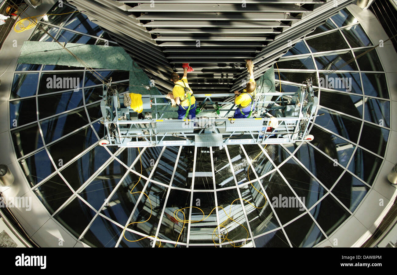 Window cleaners clean the cupola of the Reichstag building in Berlin