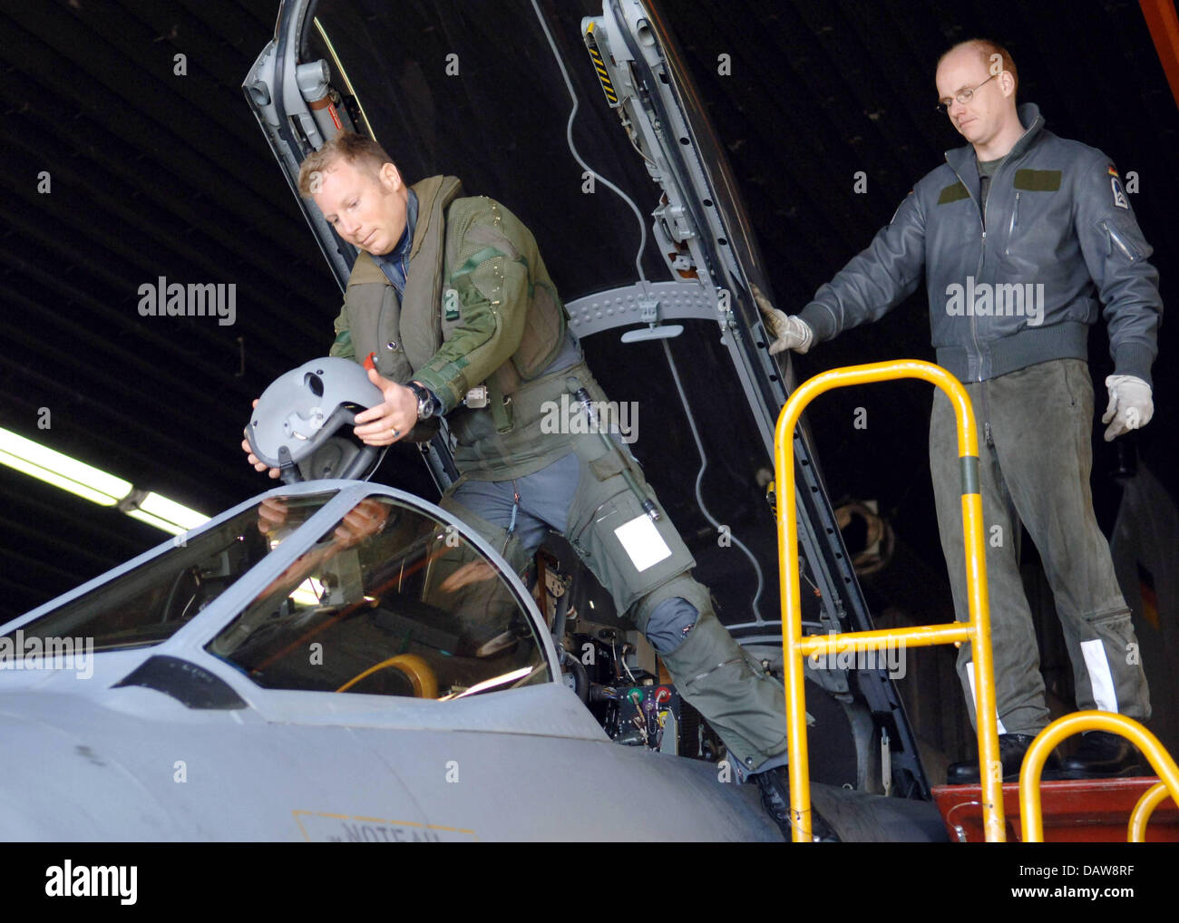 Pilot Alexander S. (L) of 'Aufklaerungsgeschwader 51 Immelmann' enters the cockpit of a Tornado fighter bomber plane at Jagel airbase in Germany, Tuesday, 13 March 2007. The Tornados will be deployed on a Recce mission in support of other NATO ISAF troops in southern Afghanistan. Photo: Wulf Pfeiffer Stock Photo
