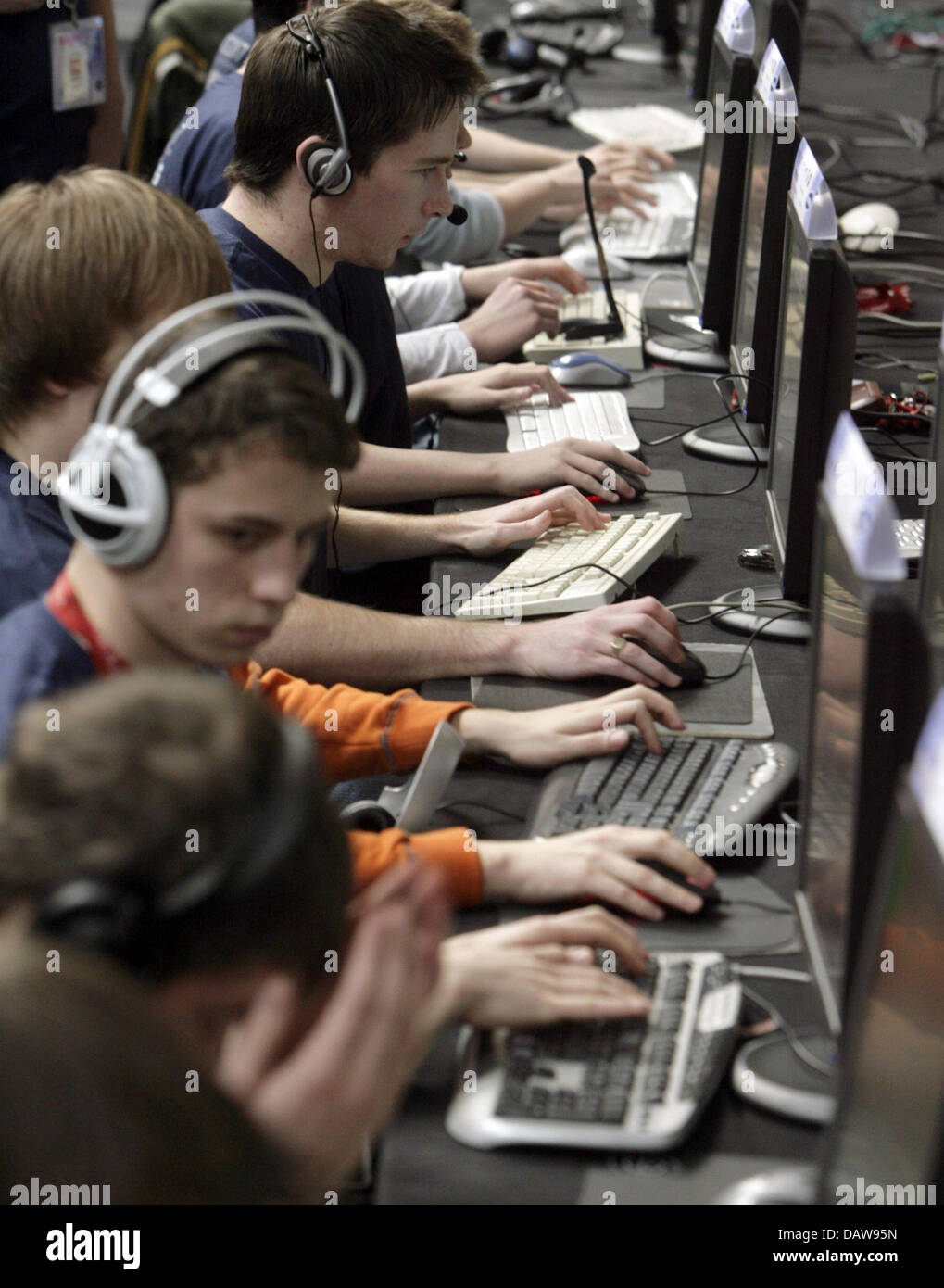 Competitors in the World Cyber Games 2007 compete in 'Counter Strike' at the 'CeBIT 2007' trade fair in Hanover, Germany, Thursday, 15 March 2007. CeBIT is the world's largest trade fair showcasing digital IT and telecommunications solutions for home and work environments and this year runs from 15th until 21st March 2007. More than 6,000 companies from 77 countries will exhibit th Stock Photo