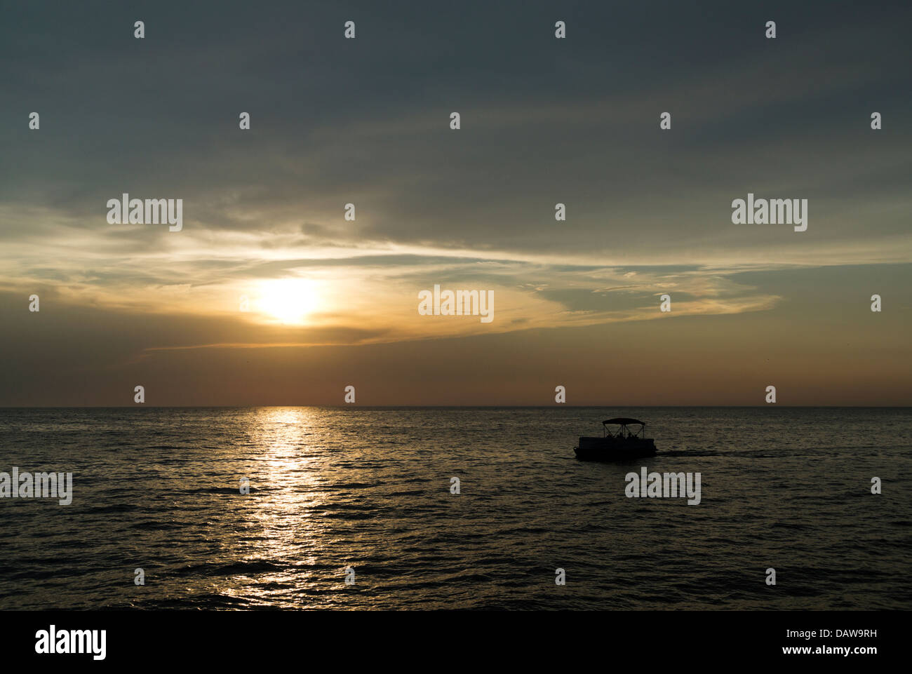 Pontoon boat cruising on Lake Michigan near the White Lake Channel in