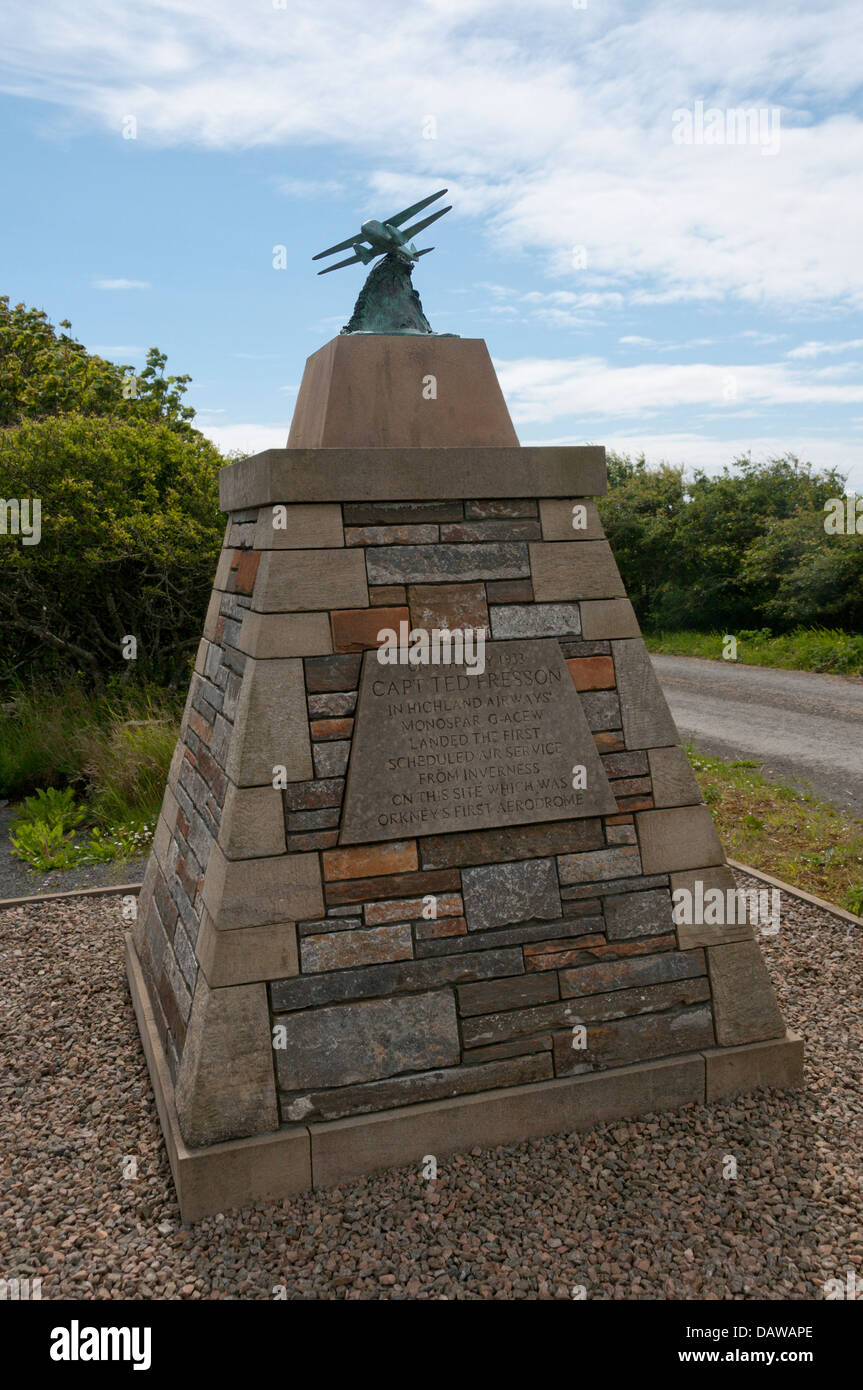 A memorial at the site of Orkney's first airport on the outskirts of Kirkwall records the inaugural flight by Capt Ted Fresson, Stock Photo