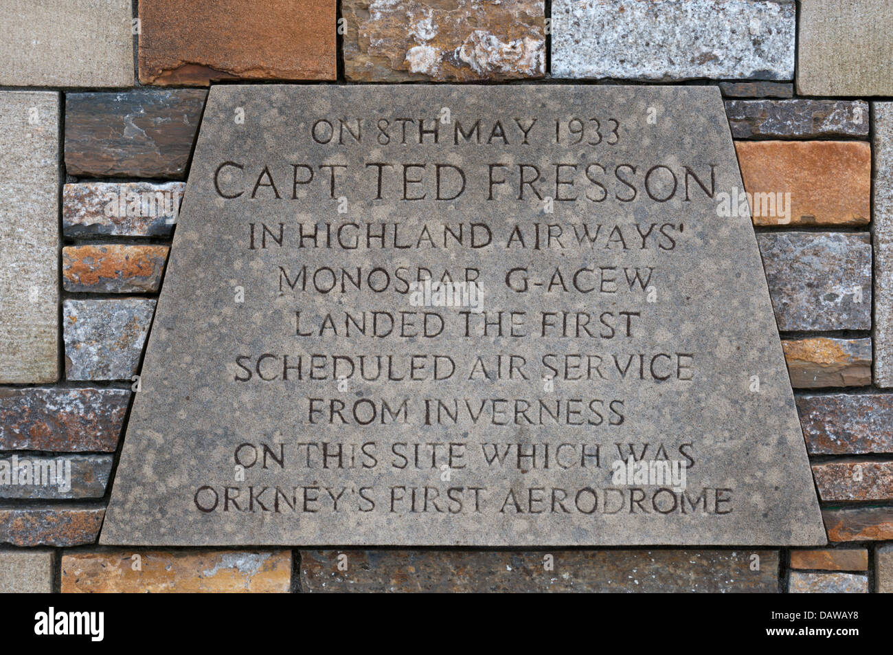 A plaque at the site of Orkney's first airport on the outskirts of Kirkwall records the inaugural flight by Capt Ted Fresson, Stock Photo