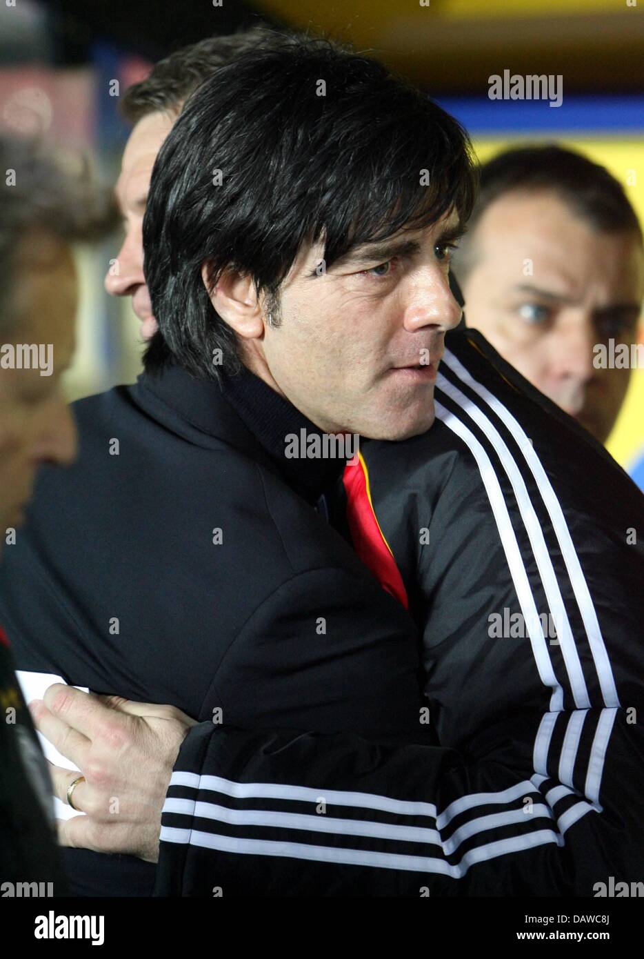 German national team head coach Joachim Loew (front) is hugged after winning the EURO 2008 qualifier Czech Republic v Germany at the Toyota Arena stadium of Prague, Czech Republic, 24 March 2007. Germany won the match 1-2 and takes over the lead in the group D table. Photo: Bernd Weissbrod Stock Photo