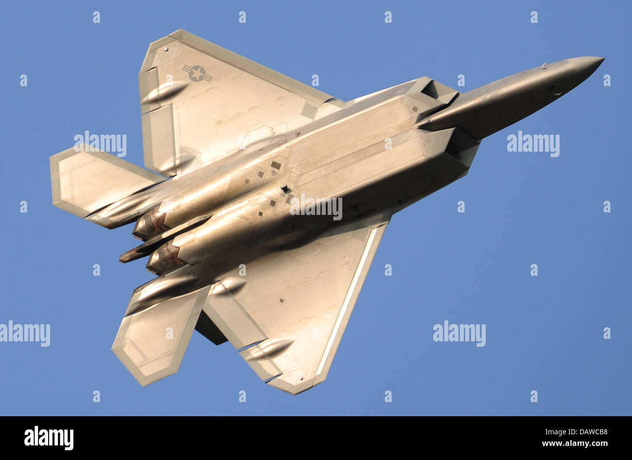 A US Air Force F-22 Raptor stealth fighter aircraft maneuvers during a training operations July 19, 2013 at Joint Base Elmendorf Richardson, Alaska. Stock Photo