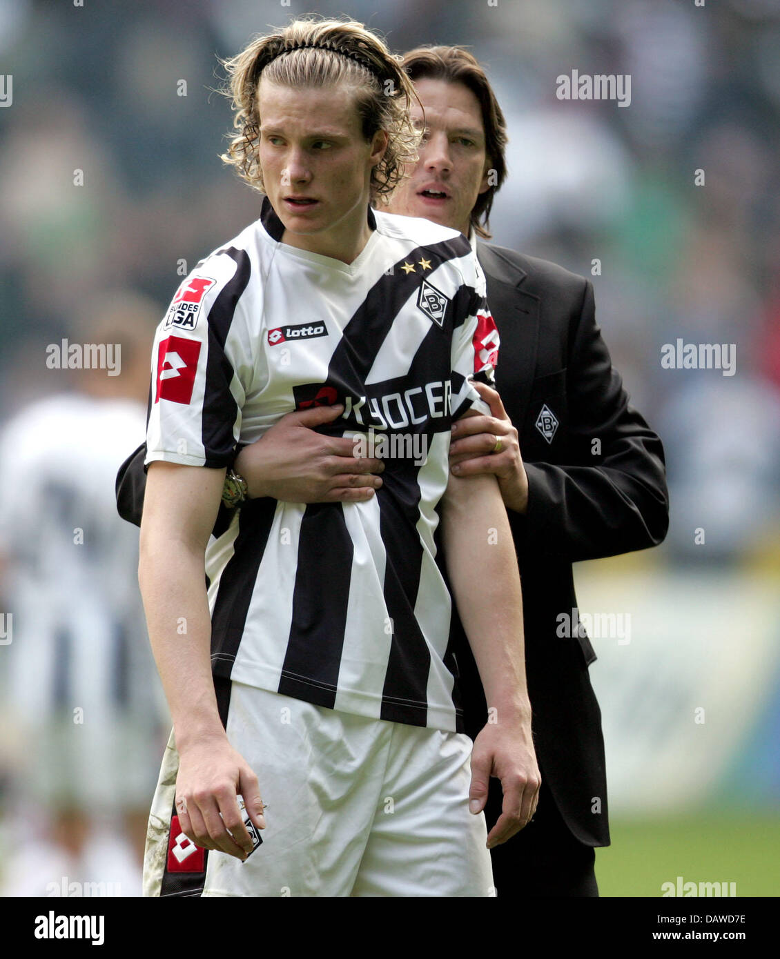 Moenchengladbach's Marcell Jansen (L) is hugged by the club's sporting director Christian Ziege (R) after the Bundesliga match Borussia Moenchengladbach v Eintracht Frankfurt at the Borussia Park of Moenchengladbach, Germany, Saturday, 31 March 2007. The match ended in a 1-1 draw. Photo: Rolf Vennenbernd (ATTENTION: BLOCKING PERIOD! The DFL permits the further utilisation of the pi Stock Photo