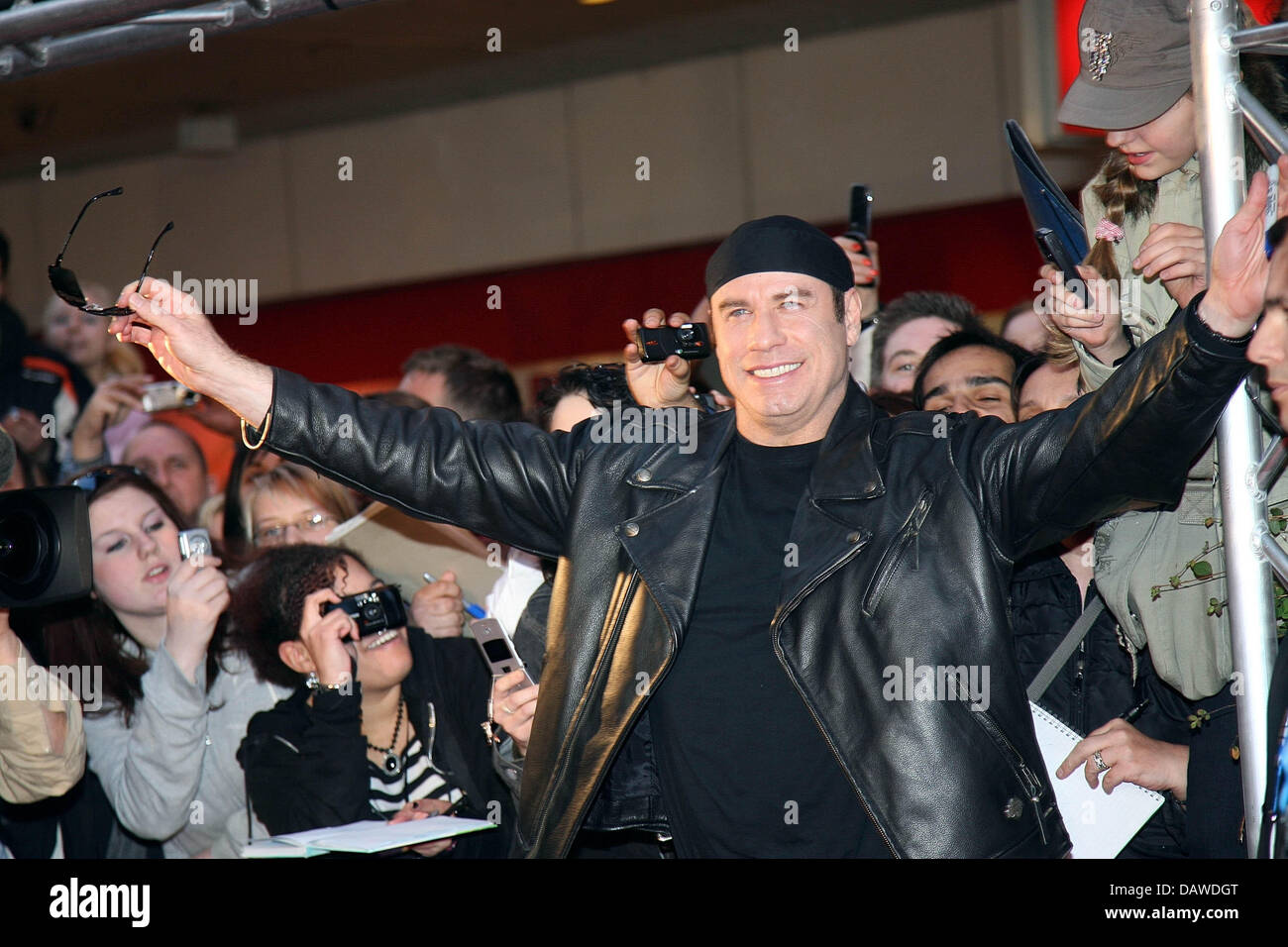 US actor John Travolta poses for the cameras at the German premiere of his film 'Born to be wild' in Munich, Germany, Monday, 02 April 2007. Photo: Ursula Dueren Stock Photo