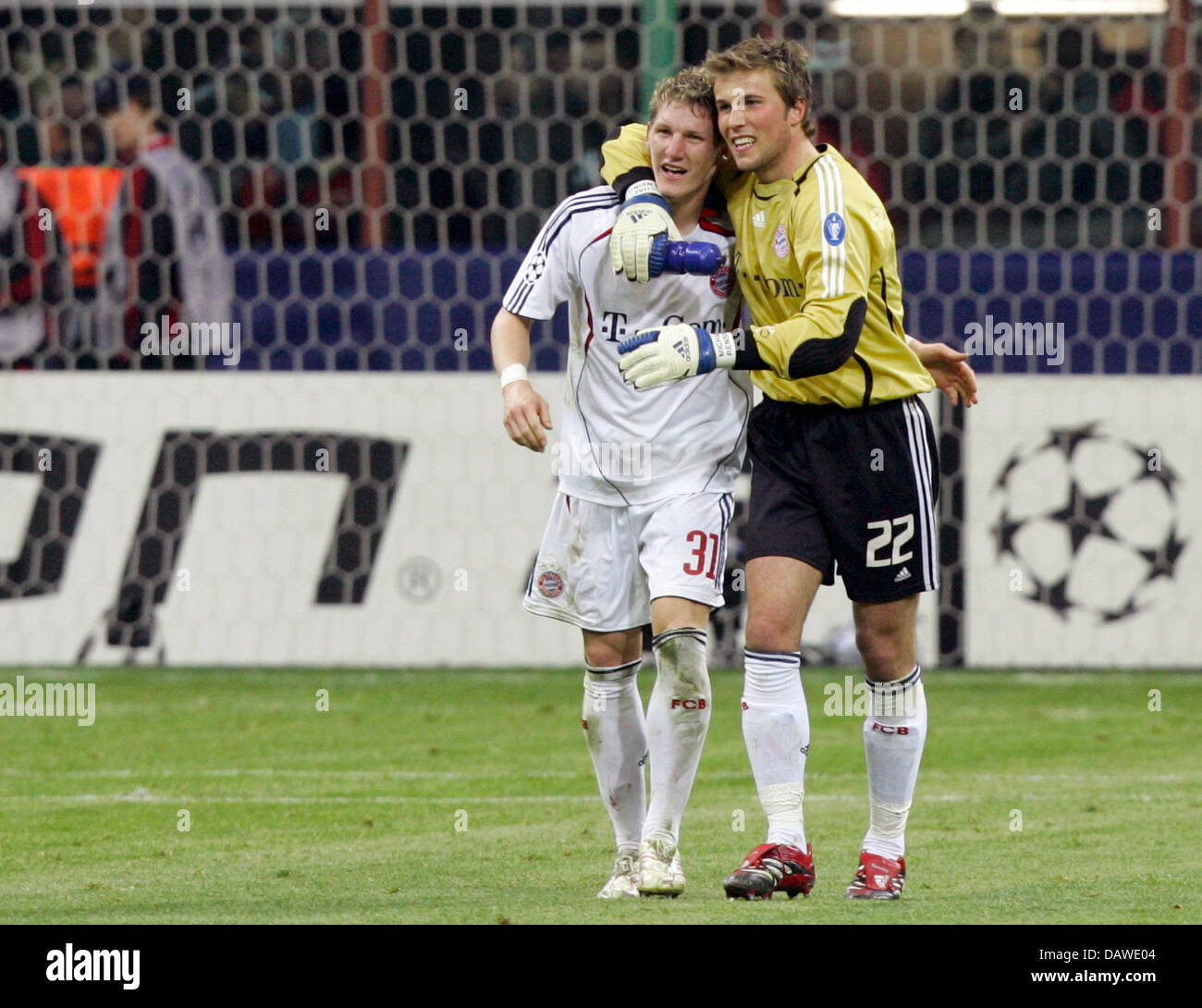 Goalie Michael Rensing (R) and Bastian Schweinsteiger of Bayern Munich ...