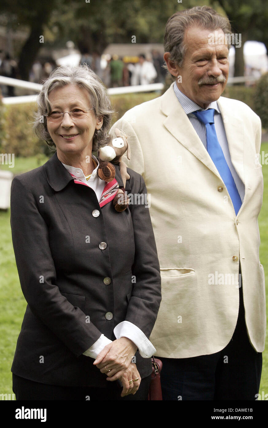 (dpa file) - German publisher Alfred Neven DuMont (R) and his wife Hedwig smile at the 5th charity horse race at the racecourse in Cologne-Weidenpesch, Germany, Sunday, 24 September 2006. Traditionally lots of celebrities came to sign autographs, face-paint children and sell lottery tickets. Since 1954 the 'Kinderschutzbund Cologne' stands up for the improvement of childrens' and f Stock Photo