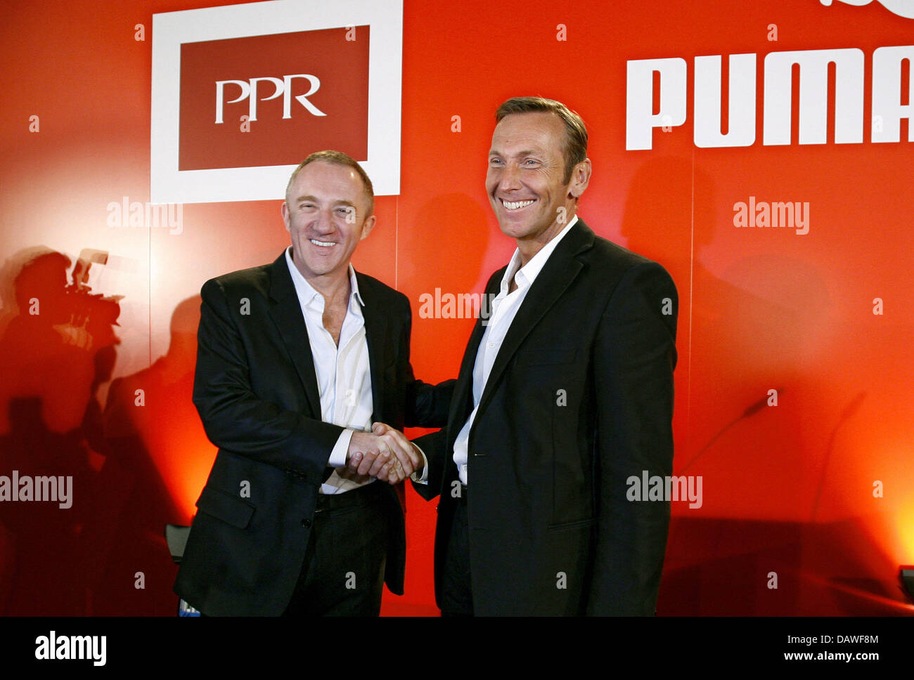 Puma AG CEO Jochen Zeitz (R) welcomes French luxury group  Pinault-Printemps-Redoute's (PPR) chairman Francois-Henri Pinault for a  press conference in Nuremberg, Germany, Thursday 12 April 2007. PPR, owner  of the Gucci and