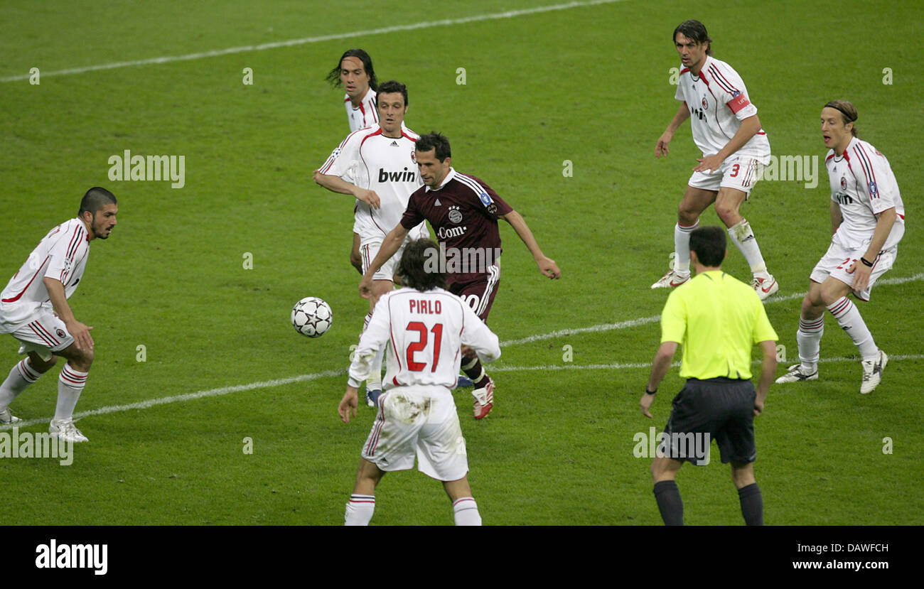 Hasan Salihamidziz of FC Bayern Munich vies for the ball with six players of AC Mailand during the UEFA Champions League quarter-final at Allianz Arena in Munich, Germany, Wednesday, 11 April 2007. Milan scored twice in four minutes to defeat Munich 0-2 and book a semi-final with Manchester United. Photo: Andreas Gebert Stock Photo