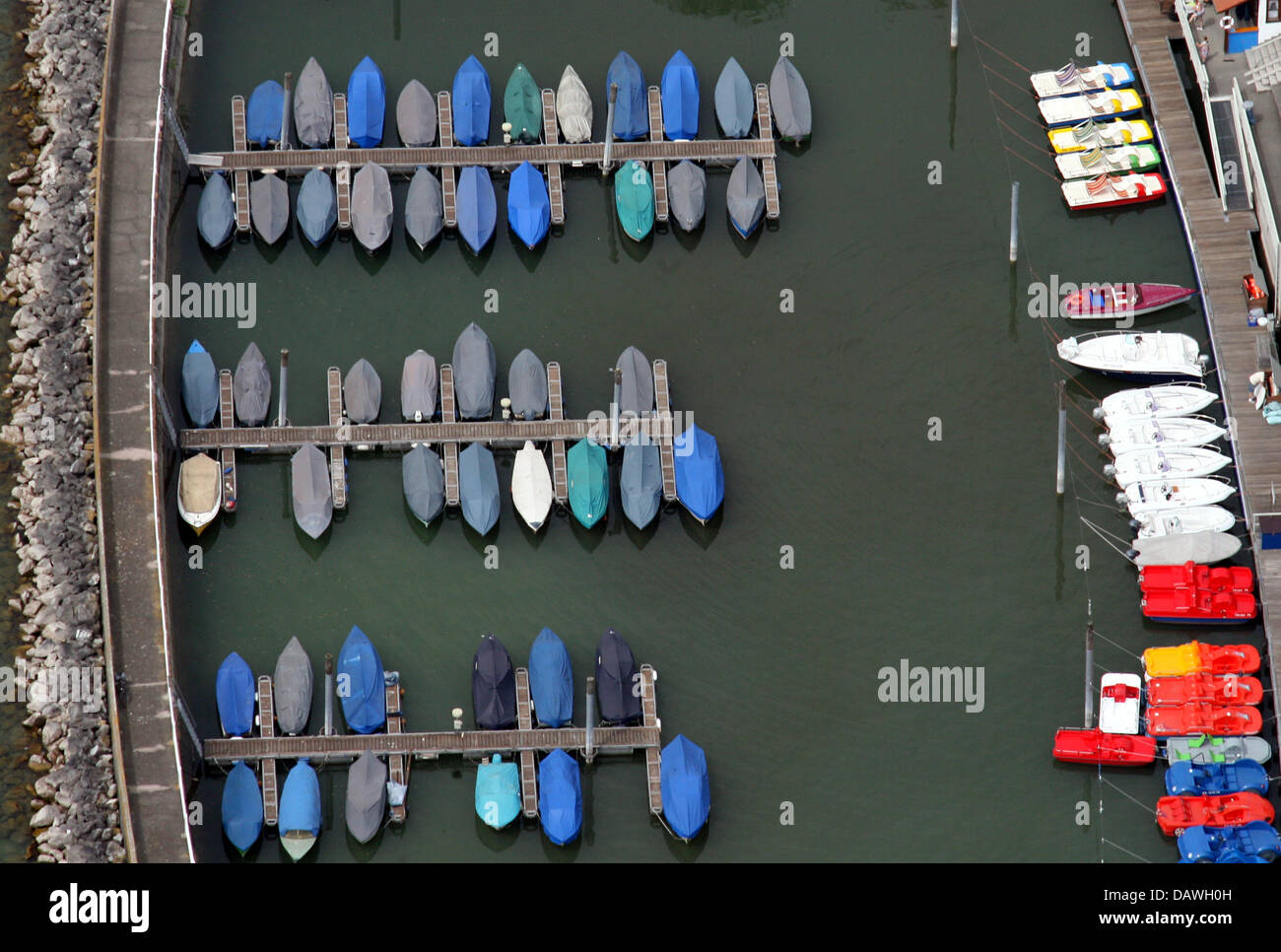 Still well packed boats lie at harbour in Friedrichshafen on Lake Constance, Germany, Tuesday, 24 April 2007. They await action in the early summerlike temperatures. Photo: Patrick Seeger Stock Photo