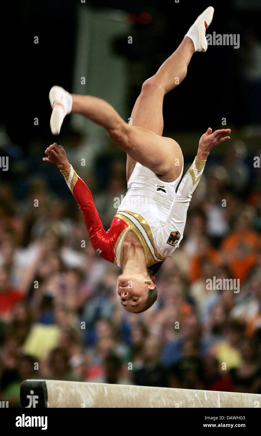 German gymnast Oksana Tschussovitina demonstrates an exercise on the