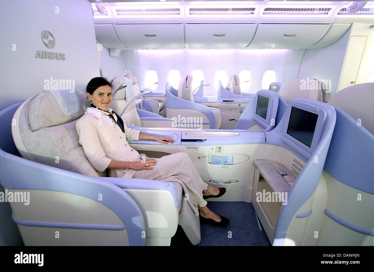 A woman presents the comfort of the First Class in an Airbus A380 in Hamburg, Germany, 17 April 2007. Photo: Ulrich Perrey Stock Photo