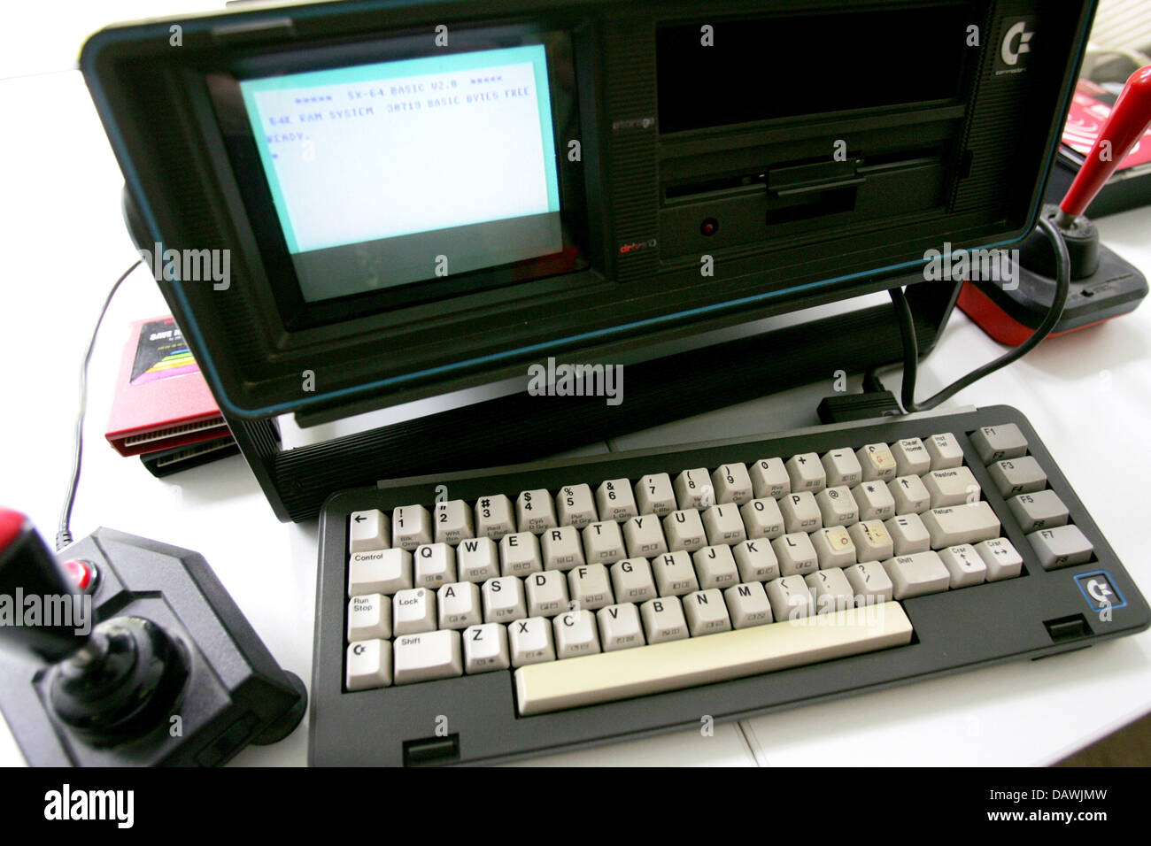 A Commodore SX-64 pictured at a press conference in Munich, Germany, 24 April 2007. The SX-64 built between 1983 and 1986 was the first portable computer that included a 5' colour screen. Unfortunately it did not include a rechargeable battery. Photo: Lukas Barth Stock Photo