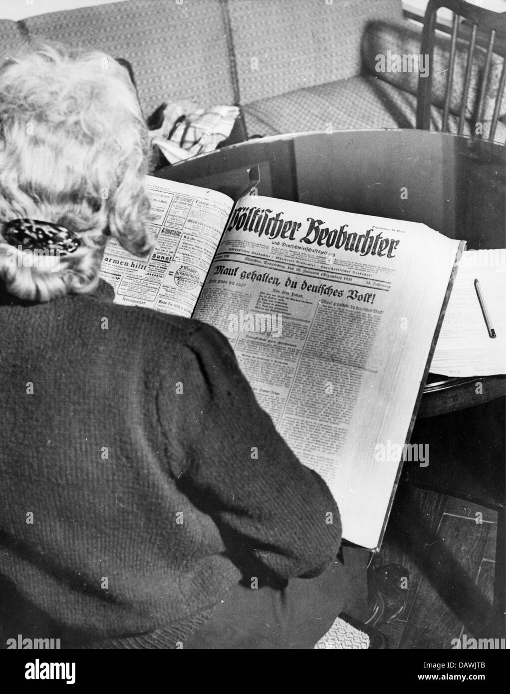 science, history, Institut fuer Zeitgeschichte (Institute of Contemporary History), Munich, Germany, staff member reading newspaper 'Voelkischer Beobachter' from 1920, circa 1950, Additional-Rights-Clearences-Not Available Stock Photo