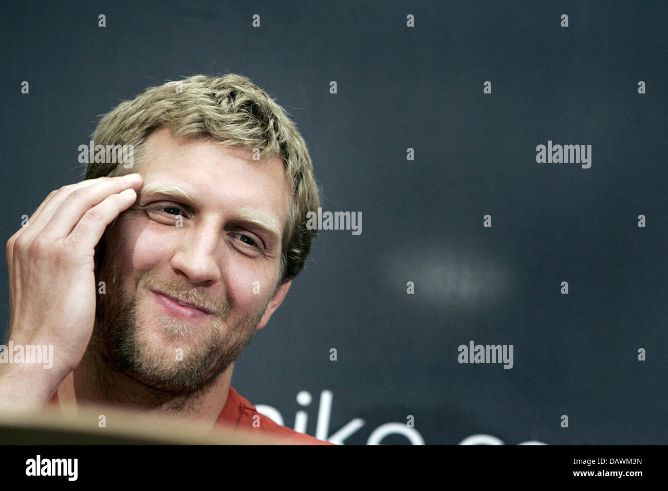 German basketball pro Dirk Nowitzki smiles at a press conference in Frankfurt Main, Germany, 22 May 2007. Nowitzki was elected MVP of this year's NBA season being the first-ever European to be granted this award. Photo: Frank May Stock Photo