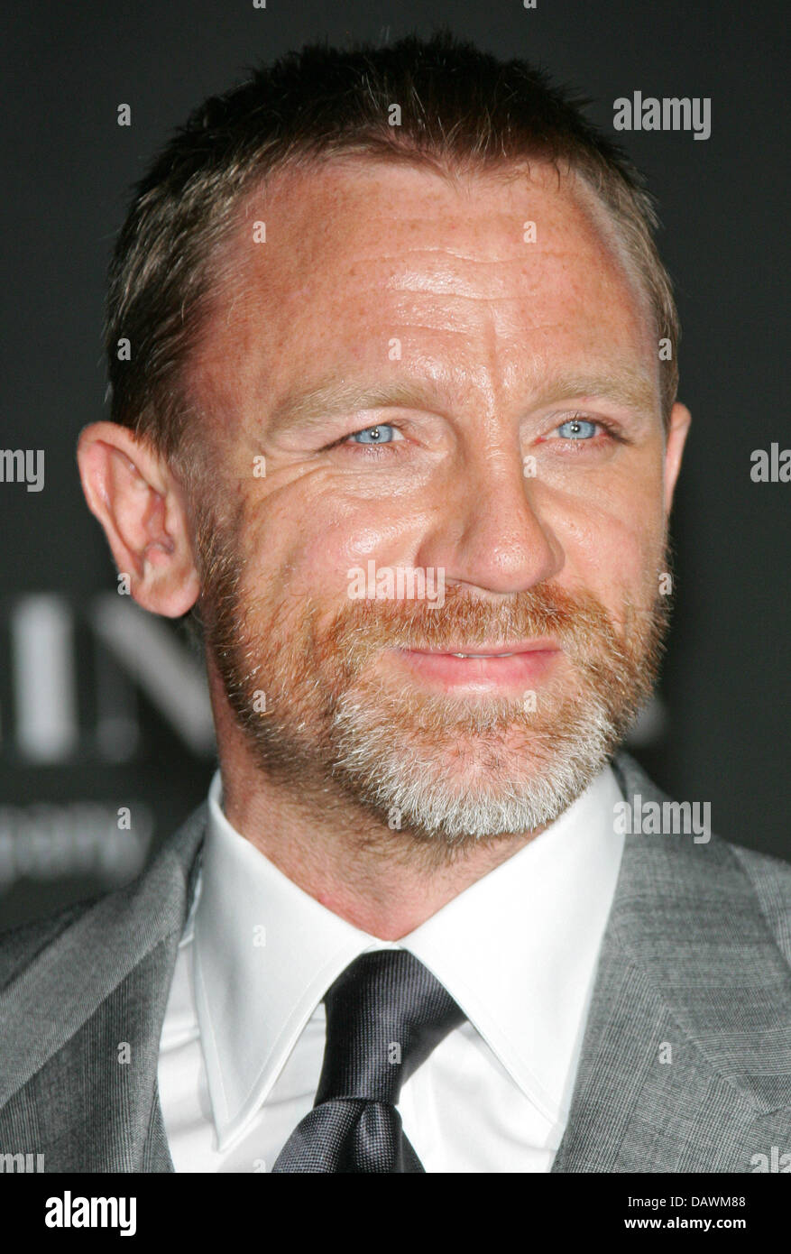 British actor Daniel Craig smiles for the cameras as he arrives for the 40th anniversary party of US film company 'New Line Cinema' in Cannes, France, 22 May 2007. Photo: Hubert Boesl Stock Photo
