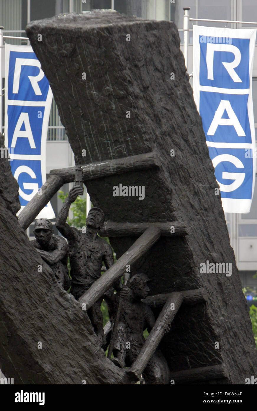 The RAG headquarters are pictured behind an artpiece depicting miners in Essen, Germany, 26 May 2007. The company doubled its profit in the first quarter this year and emphasised its plan for initial public offering of the newly formed joint stock company. Photo: Bernd Thissen Stock Photo