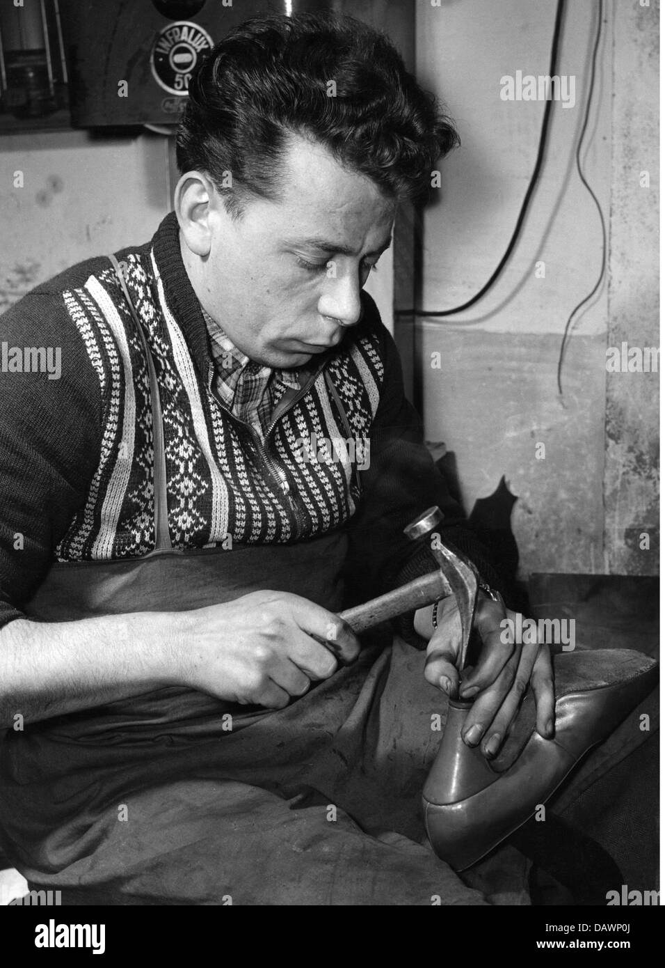 people, professions, shoemaker, nailing a lady's shoe, West Germany, 1950s, , Additional-Rights-Clearences-Not Available Stock Photo