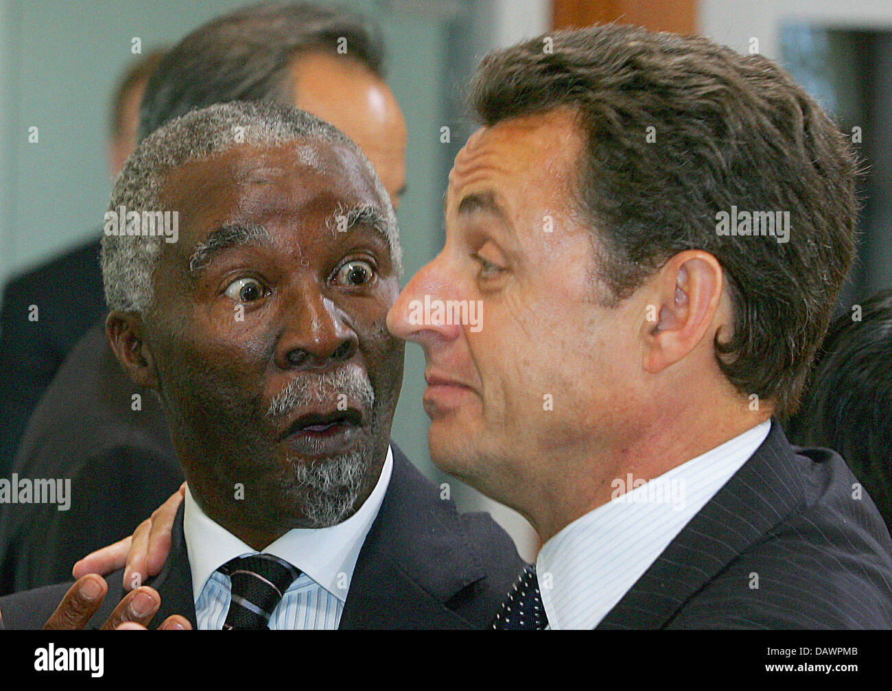 South African President Thabo Mbeki (L) looks surprised by French President Nicolas Sarkozy (R) at a session of the G8 with the so-called Outreach countries of Africa at the G8 Summit in Heiligendamm, Germany, 08 June 2007. The G8 states declared their will to increase monetary aid for Africa. Photo: Michael Urban Stock Photo