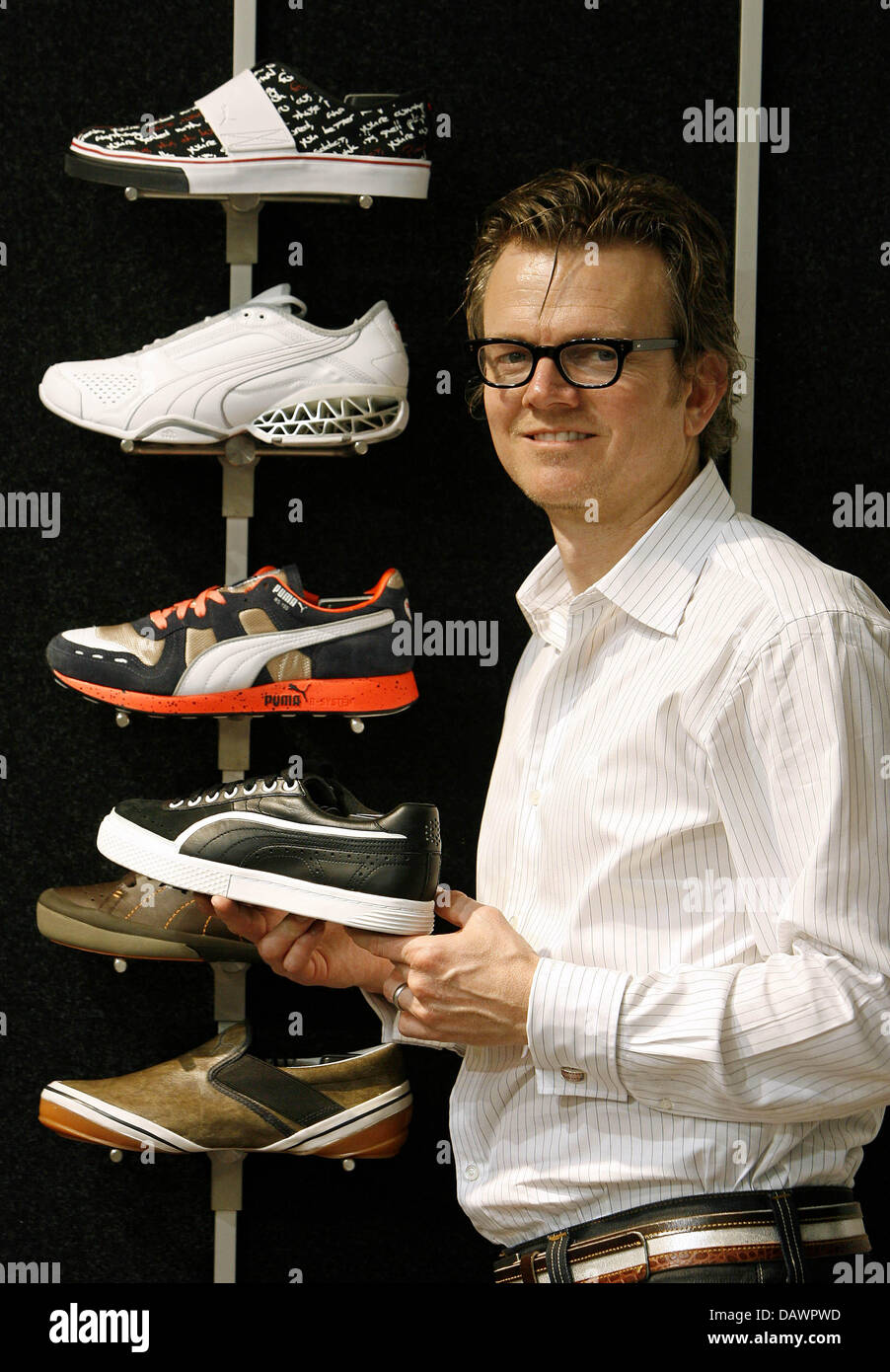 Puma senior designer Gavin Ivester poses with Puma shoes at the group's  brand centre in Nuremberg, Germany, 22 May 2007. Ivester reduced his  designing hours for he is also Senior VP and