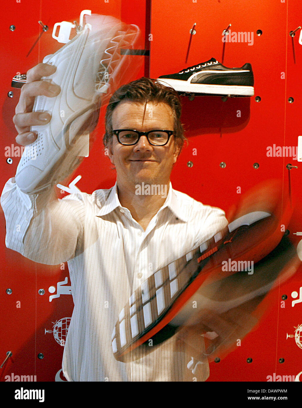 Puma senior designer Gavin Ivester poses with Puma shoes at the group's  brand centre in Nuremberg, Germany, 22 May 2007. Ivester reduced his  designing hours for he is also Senior VP and