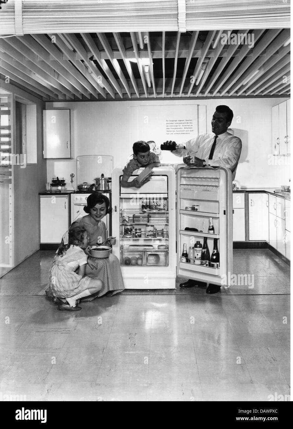 advertising, household, kitchen, family standing around a full filled refrigerator, Germany, 1959, Additional-Rights-Clearences-Not Available Stock Photo