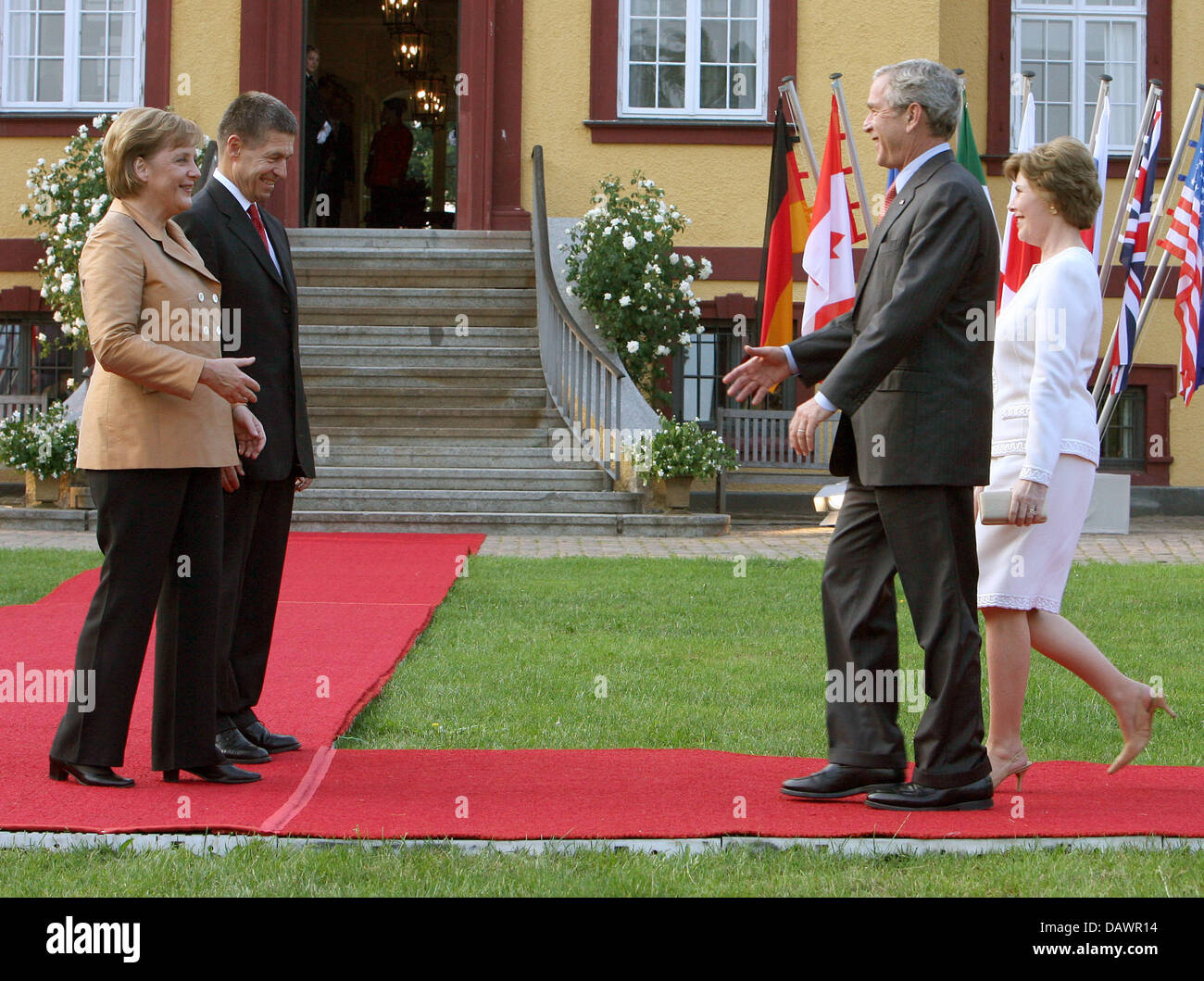 German Chancellor Angela Merkel (L) and her husband Joachim Sauer (2L