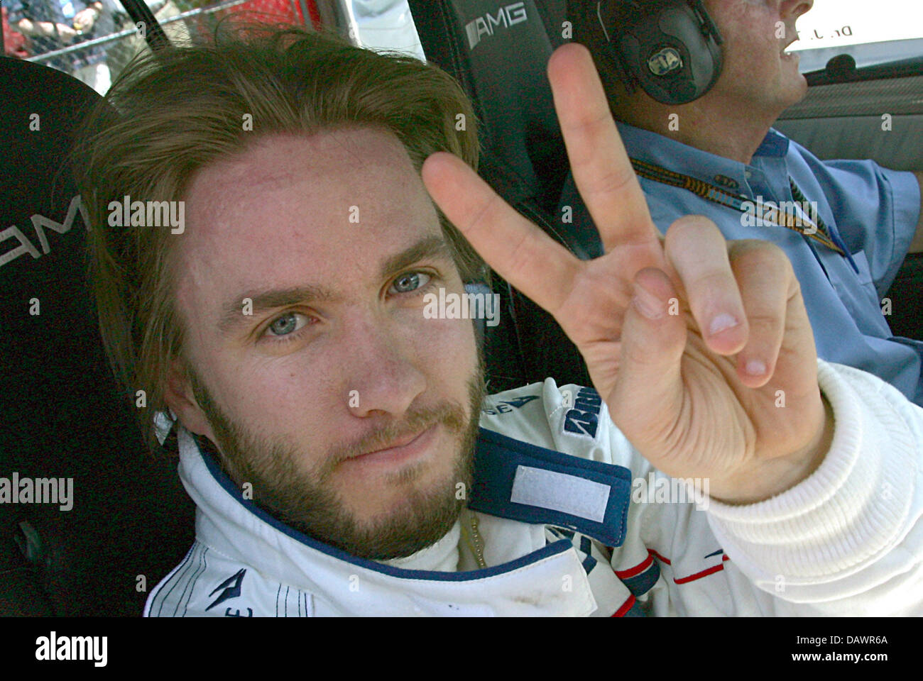 German Formula One driver Nick Heidfeld of BMW Sauber cheers his third