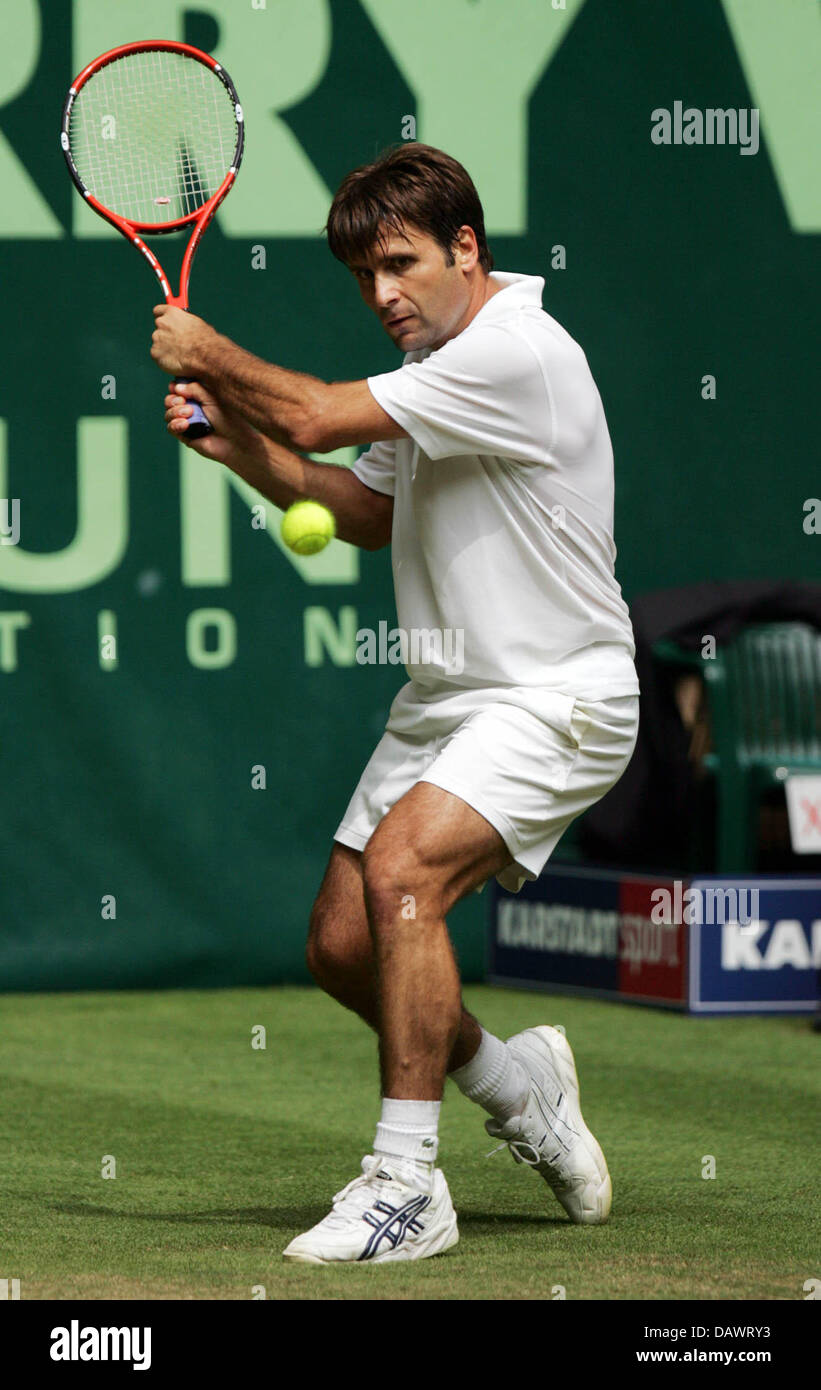 French tennis pro Fabrice Santoro hits a doublehanded forehand in his round  of the last 16 match against Czech Tomas Berdych at the Gerry Weber Open in  Halle/Westfalia, Germany, 13 June 2007.
