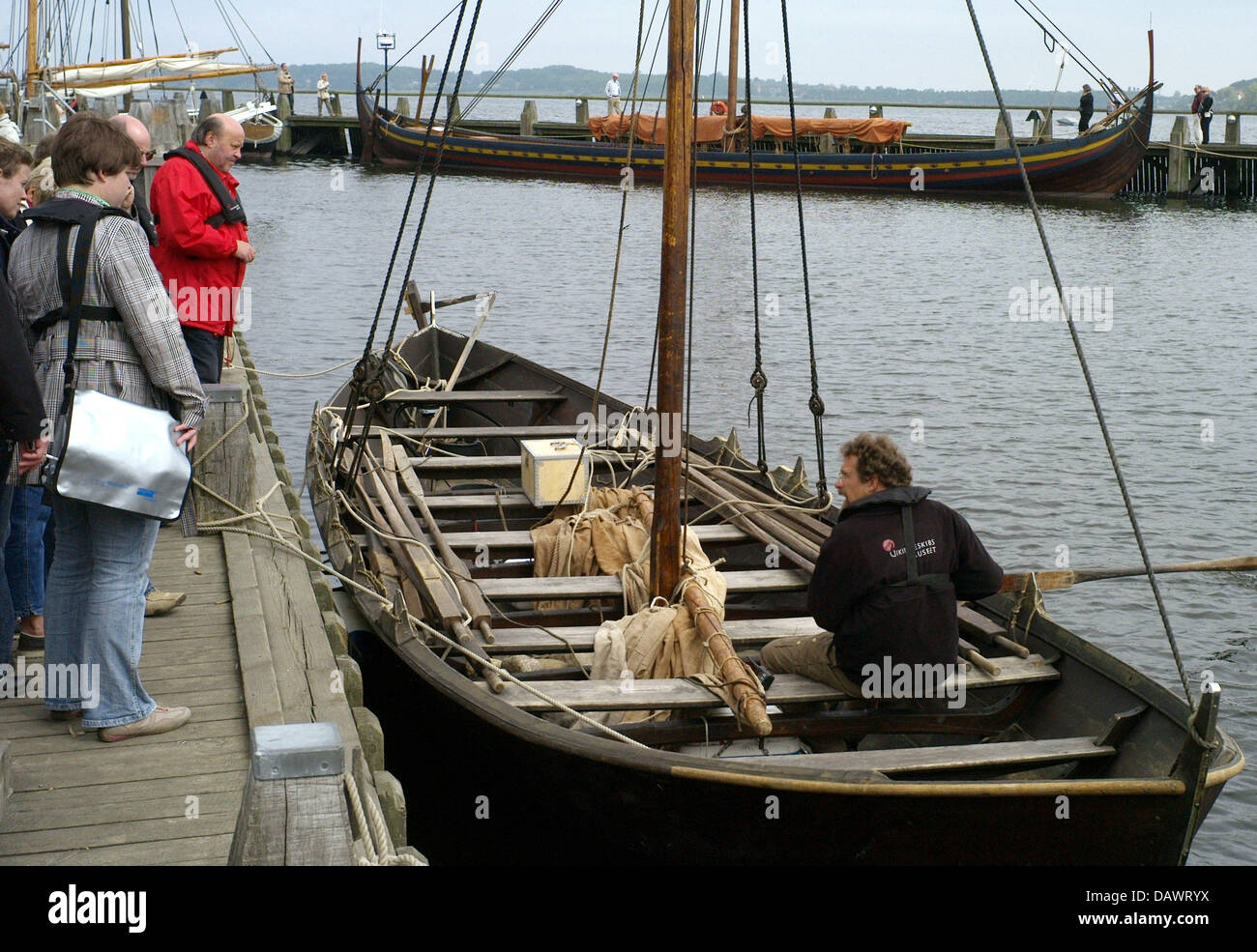 Reconstructed Viking ships lie in the harbour of the museum for Viking ships in Roskilde, Denmark, 22 May 2007. Shipbuilding and seafaring of the Vikings are presented in the museum that has its own wharf and an archaeological workshop and offers Viking ship boat trips in the summer. Photo: Maurizio Gambarini Stock Photo