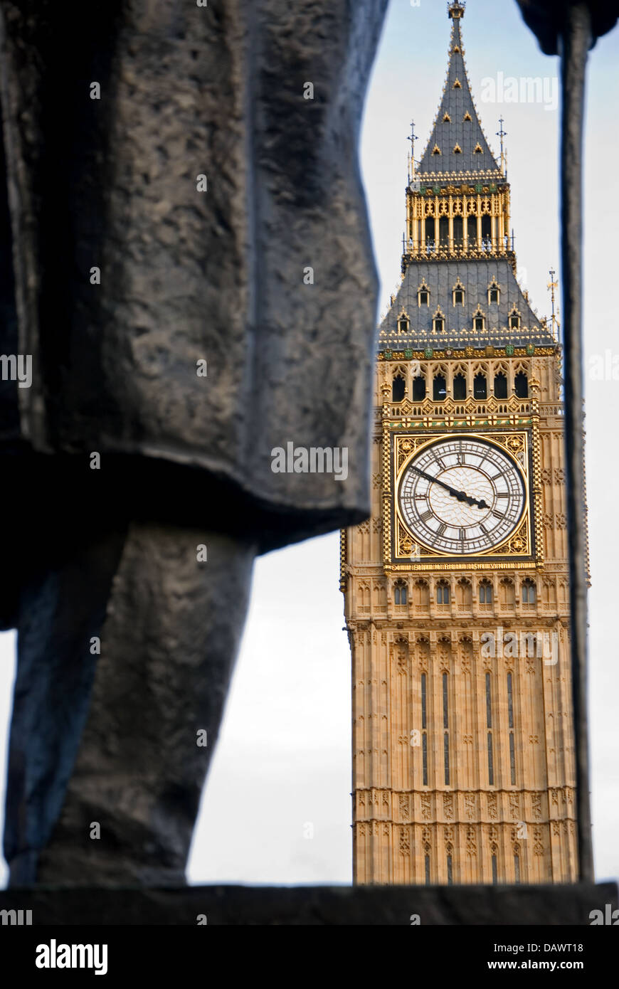 Winston Churchill's statue and the iconic London landmark of Big Ben and Queen Elizabeth tower. Stock Photo