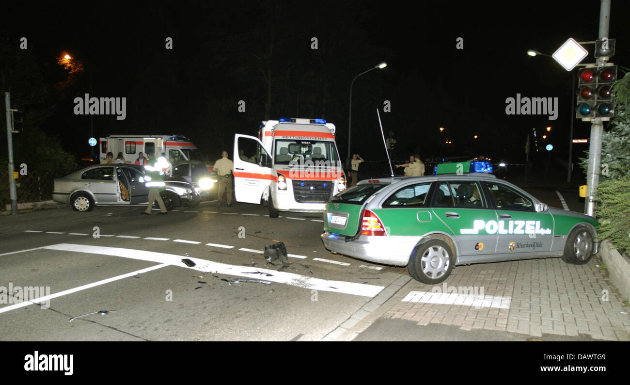 Police officers secure the scene where a young man was shot after ...