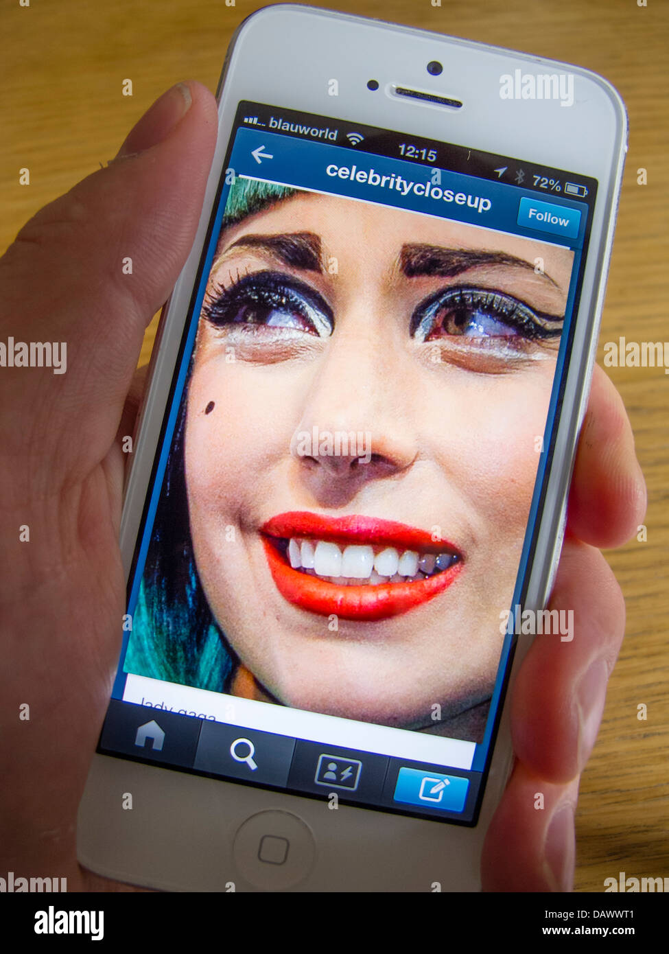 Lady Gaga photograph on Tumblr social media and photosharing app on white iPhone 5 smartphone Stock Photo