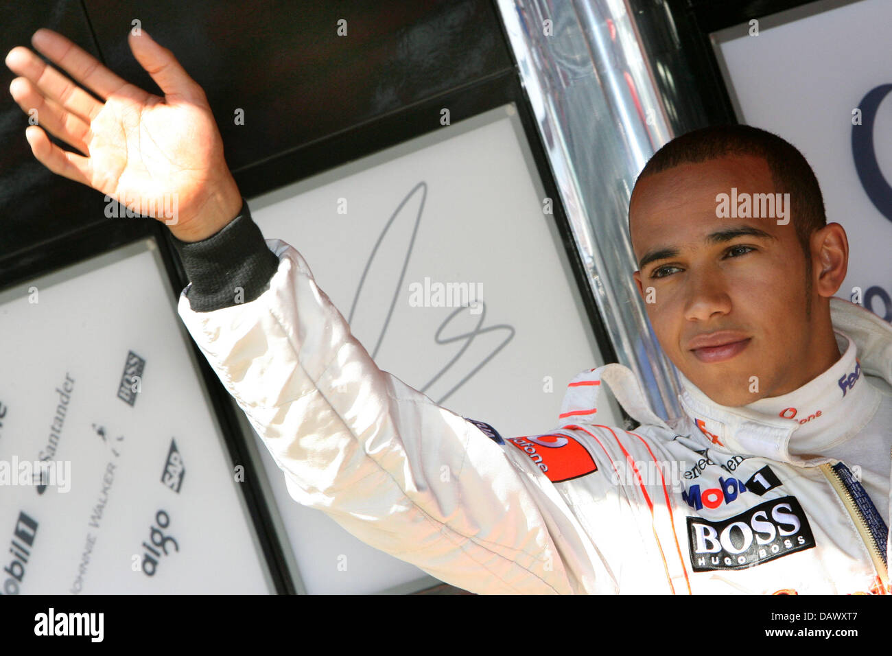 British Formula One pilot Lewis Hamilton of McLaren Mercedes waves after the third practice session at the Circuit de Catalunya race track near Barcelona, Spain, 12 May 2007. Hamilton drove the fastest lap. The 2007 Formula 1 Grand Prix of Spain takes place on 13 May. Photo: Jens Buettner Stock Photo