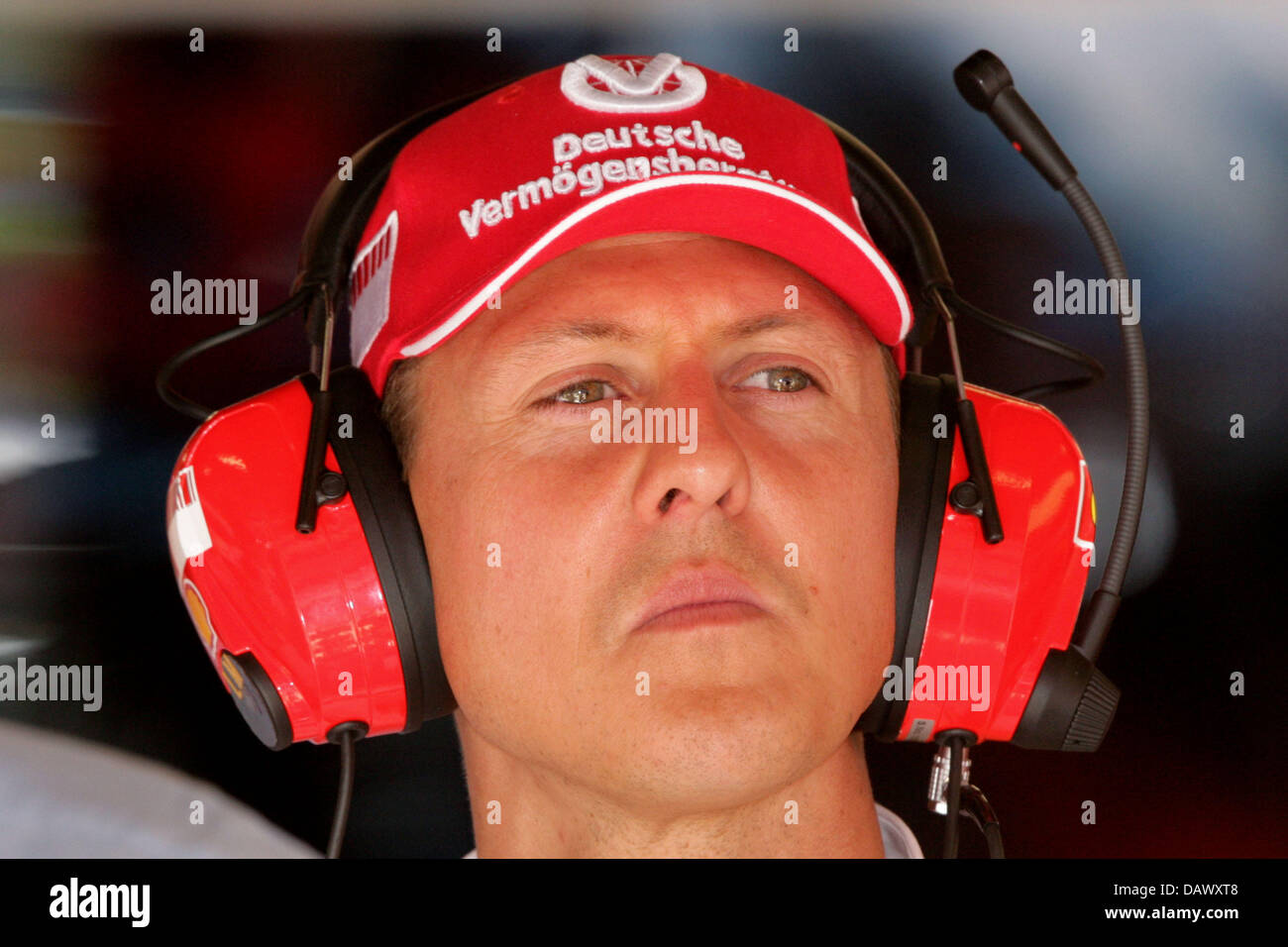 Former Formula One world champion Michael Schumacher is pictured in the Ferrari box during the third practice session at the Circuit de Catalunya race track near Barcelona, Spain, 12 May 2007. The 2007 Formula 1 Grand Prix of Spain takes place on 13 May. Photo: Jens Buettner Stock Photo