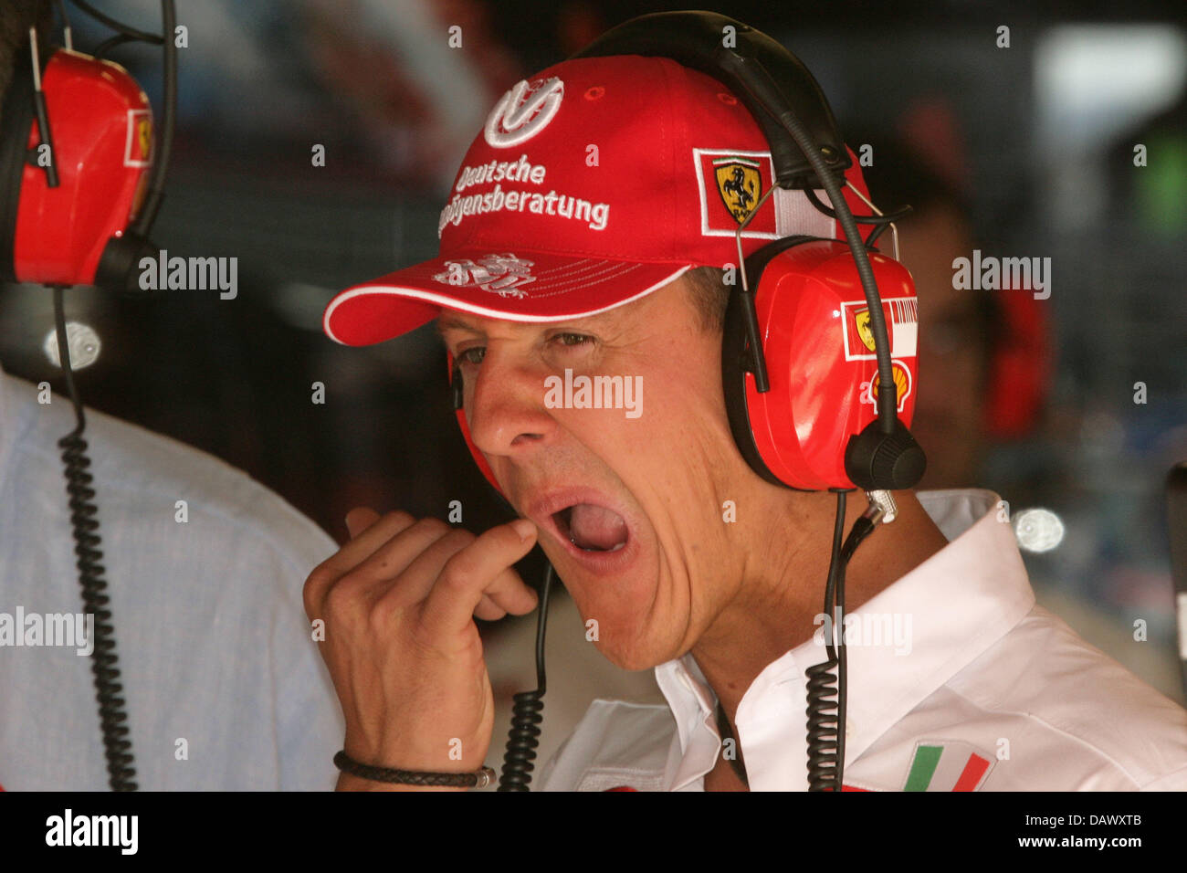 Former Formula One world champion Michael Schumacher touches his face in the Ferrari box during the third practice session at the Circuit de Catalunya race track near Barcelona, Spain, 12 May 2007. The 2007 Formula 1 Grand Prix of Spain takes place on 13 May. Photo: Jens Buettner Stock Photo
