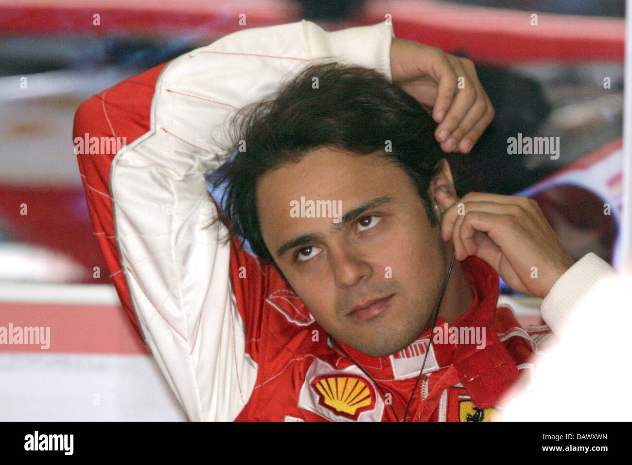 Brazilian Formula One pilot Felipe Massa of Ferrari plugs his ears during the third practice session at the Circuit de Catalunya race track near Barcelona, Spain, 12 May 2007. The 2007 Formula 1 Grand Prix of Spain takes place on 13 May. Photo: Jens Buettner Stock Photo