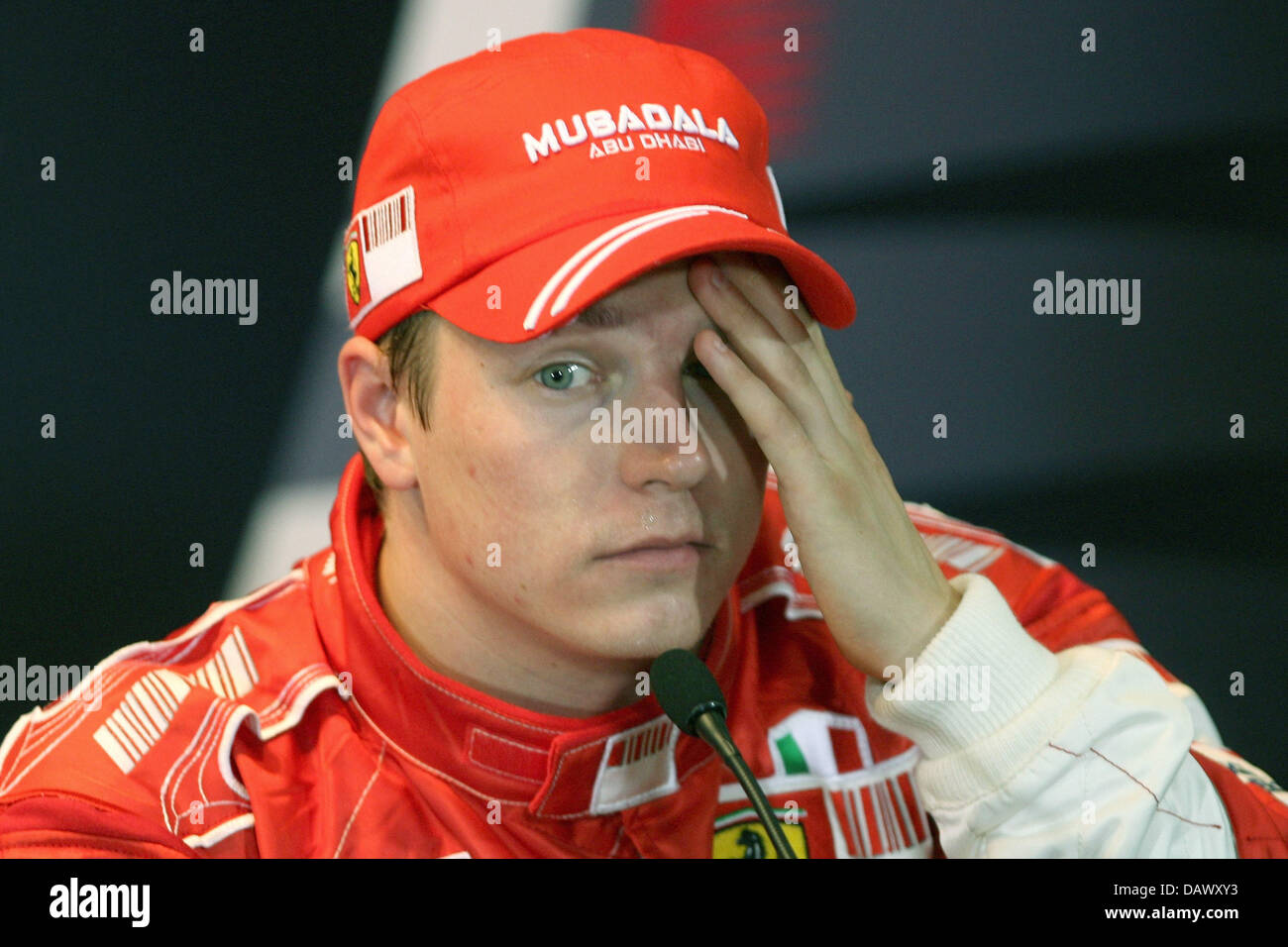 Finnish Formula One pilot Kimi Raikkonen of Ferrari touches his face during a press conference after the qualifying session at the Circuit de Catalunya race track near Barcelona, Spain, 12 May 2007. The 2007 Formula 1 Grand Prix of Spain takes place on 13 May. Photo: CARMEN JASPERSEN Stock Photo