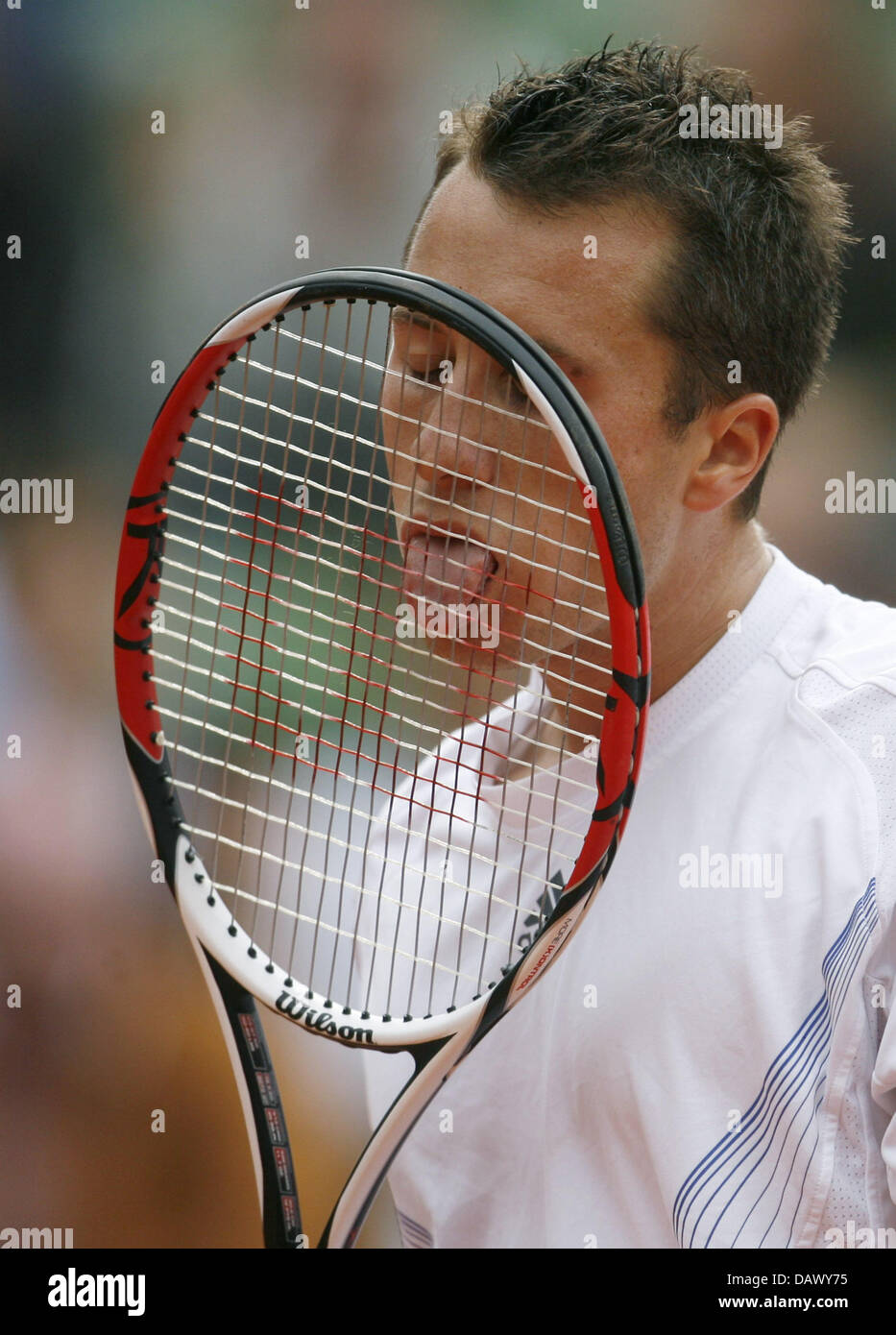 German tennis pro Philipp Kohlschreiber licks his racket during his match  against Baghdatis from Cyprus at the ATP Masters Hamburg Rothenbaum in  Hamburg, Germany, 14 May 2007. Kohlschreiber defeated Baghdatis 6-3 and