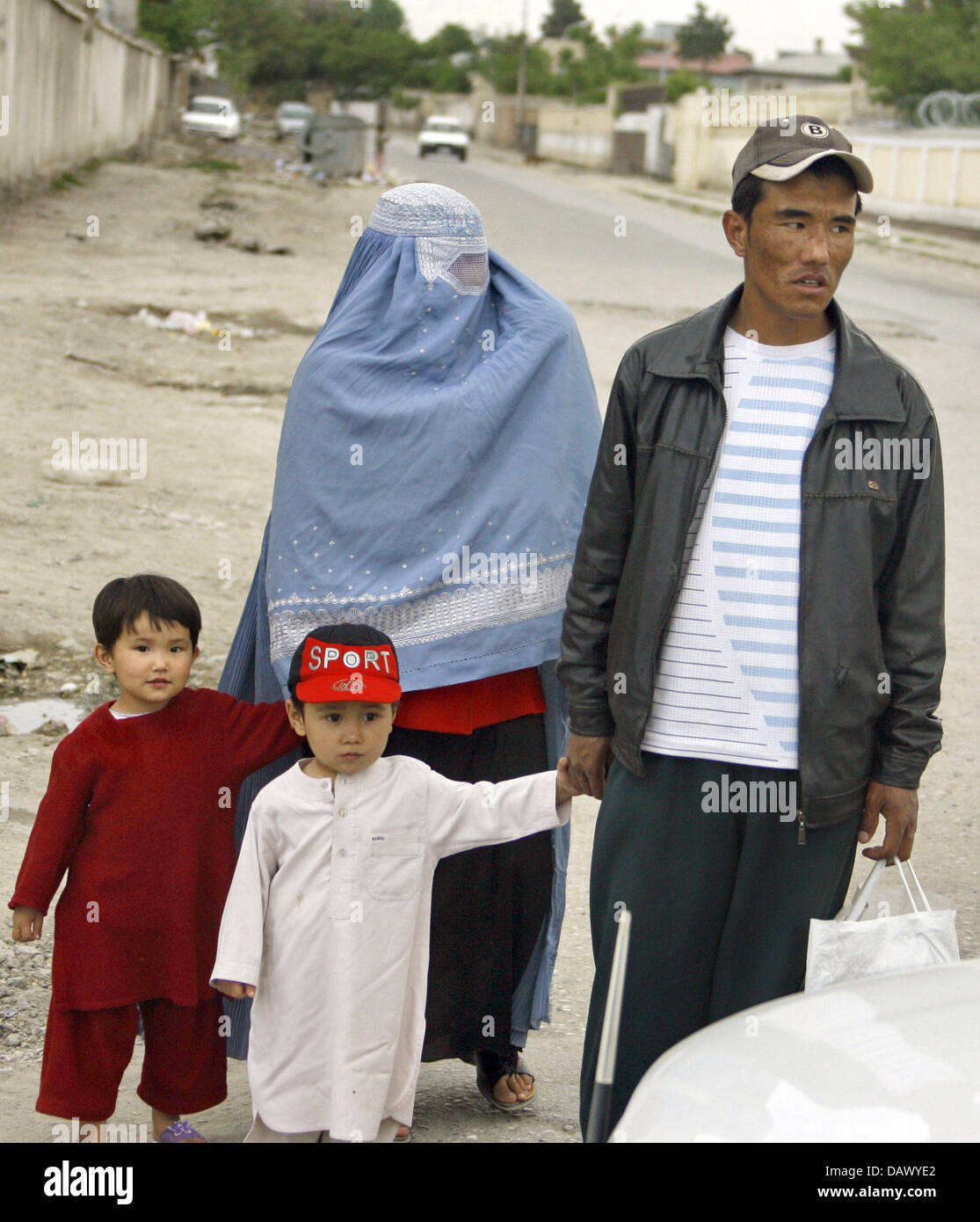 The picture shows an Afghan family with two children on a street in Kabul, Afghanistan, 30 April